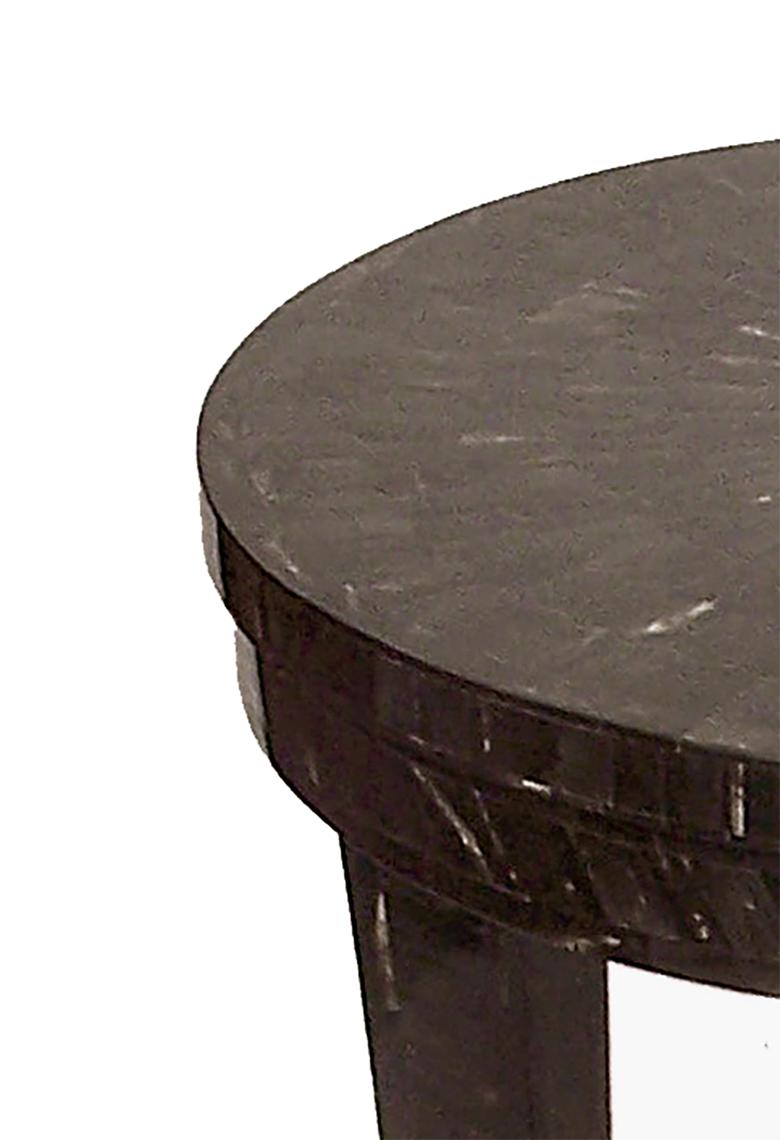 Classic contrast. Cattle horn is carefully placed over a wood frame by hand to make this exotic end table.
The top is inlayed with horn and camel bone chips alternating, making a contrasting, customizable
pattern.
Size: 16