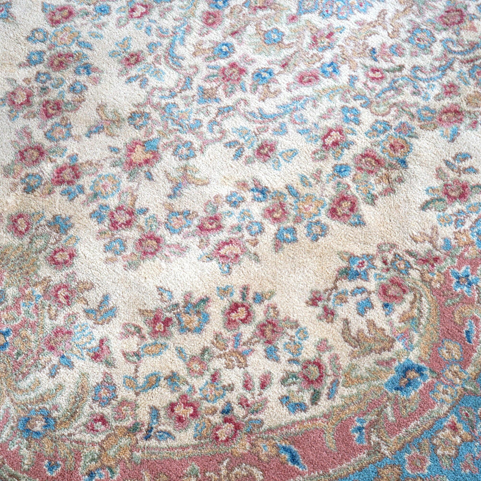 An oriental Kirman style rug by Karastan offers wool construction with central medallion on blue ground, label as photographed, c1950

Measures- 112''L x 69''W x 1'' thick

Catalogue Note: Ask about DISCOUNTED DELIVERY RATES available to most