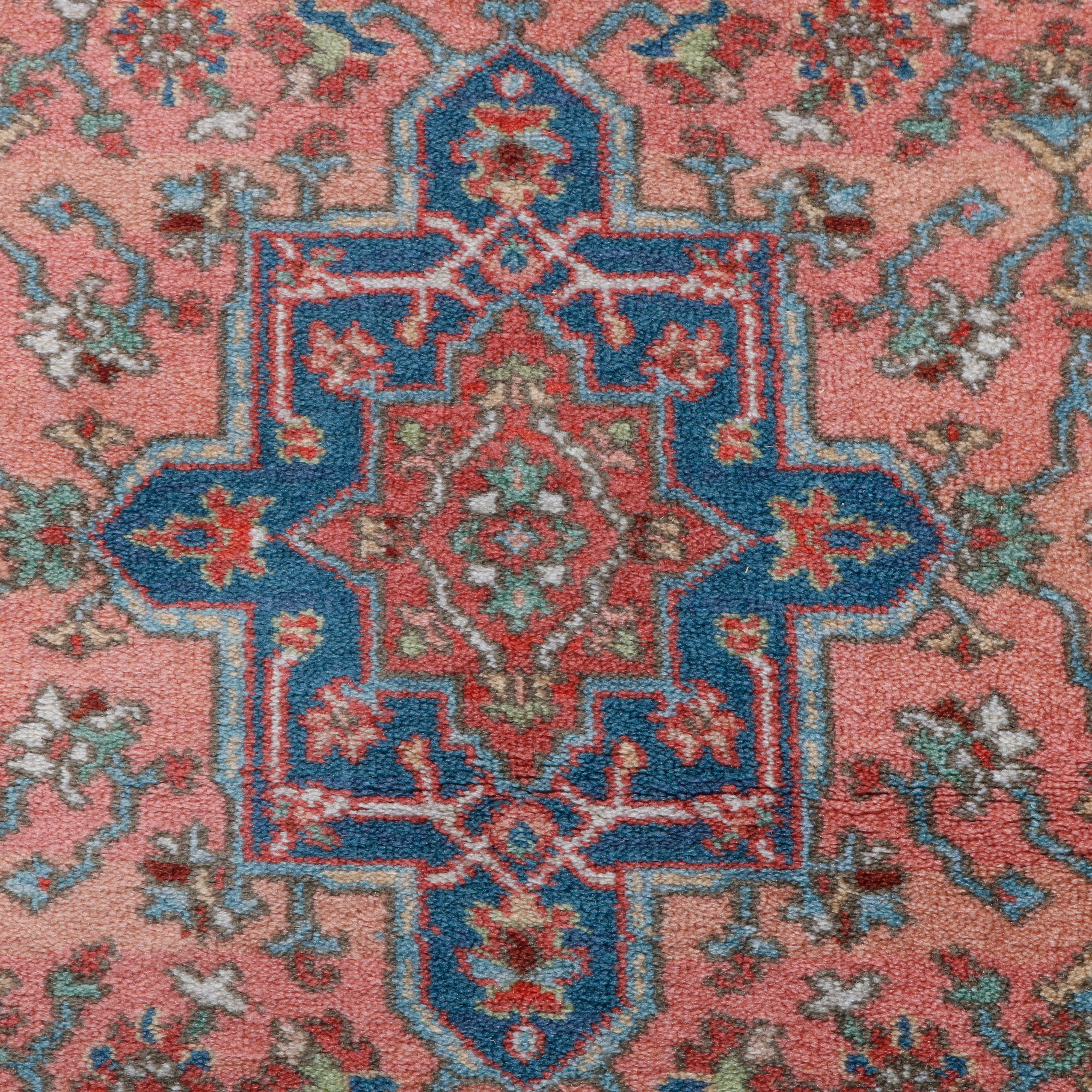 Karastan Kirman Oriental rug offers wool construction with central medallion and all-over detached floral spray on salmon red ground, original label, circa 1950

Measures: 63
