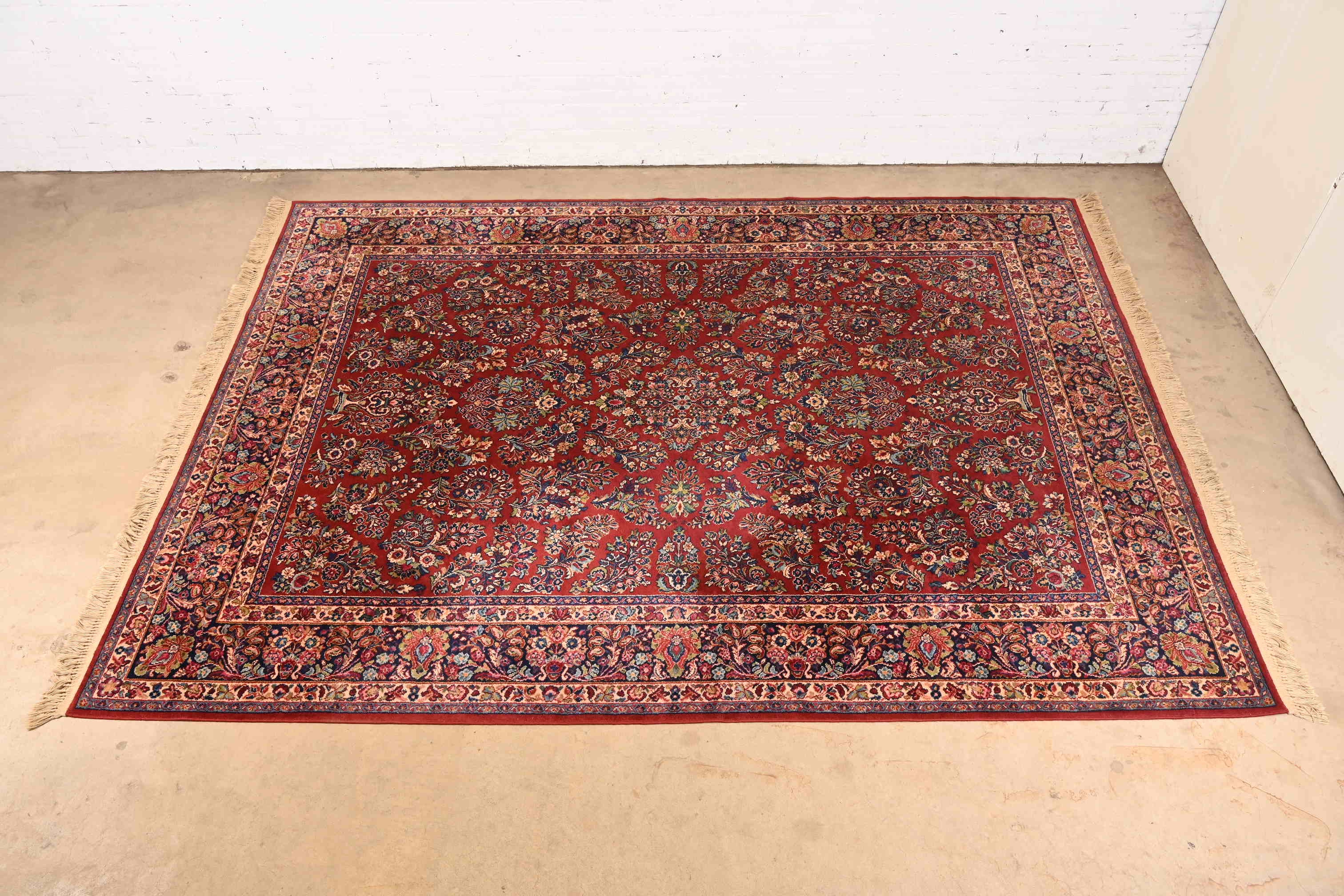 An exceptional Persian Sarouk style room size rug

By Karastan

USA, Circa 1950s

Features a beautiful floral pattern in myriad colors, and surrounded by a border of similar pattern and colors.

Measures: 8