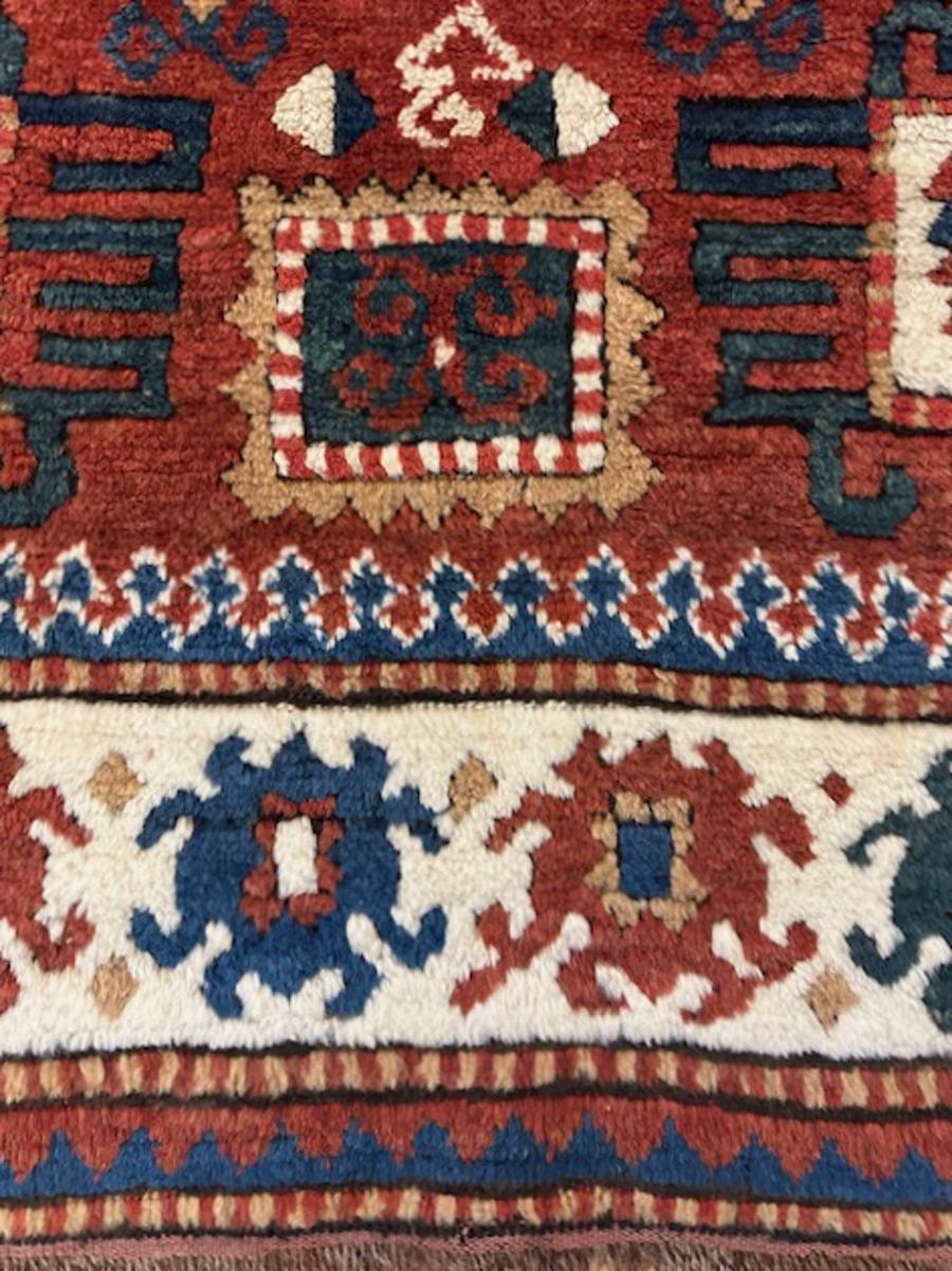 Karatchoph Kazak rug from southwest Caucasus,Armenia

Age: dated 1271=1854

Size: 6′.1″x5′.0″ (185×152 cm)

This unusual Karatchoph Kazak rug shows an ivory border with floating bug pattern tonally en suite with the octagonal medallion and the four