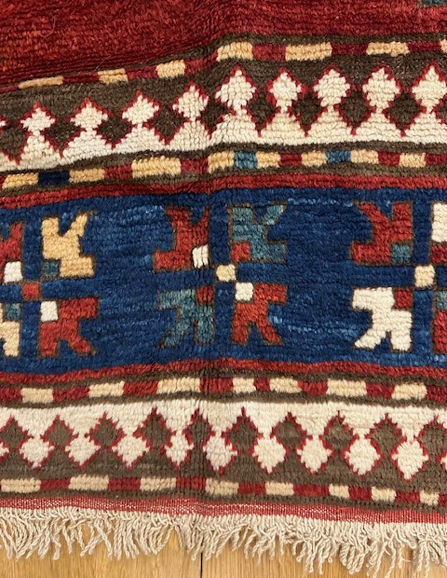 Karatchoph Kazak rug from southwest Caucasus,Armenia

Age: dated 1343=1924

Size: 7′.6″x6′.0″ (229×183 cm)

This unusual and interesting Karatchoph variant shows an octagonal central medallion doubly edged with curly hooks in ivory,dark brown and