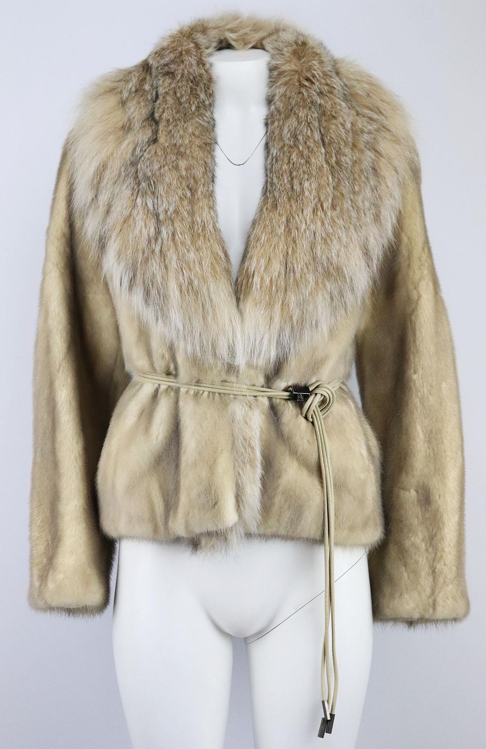 This jacket by Karee adds a bit of glamour to any outfit with the different textures and colours, it been cut from mink-fur and a large lynx-fur collar with crystal-embellished buckle fastening at front. Beige mink and lynx fur. Buckle fastening at