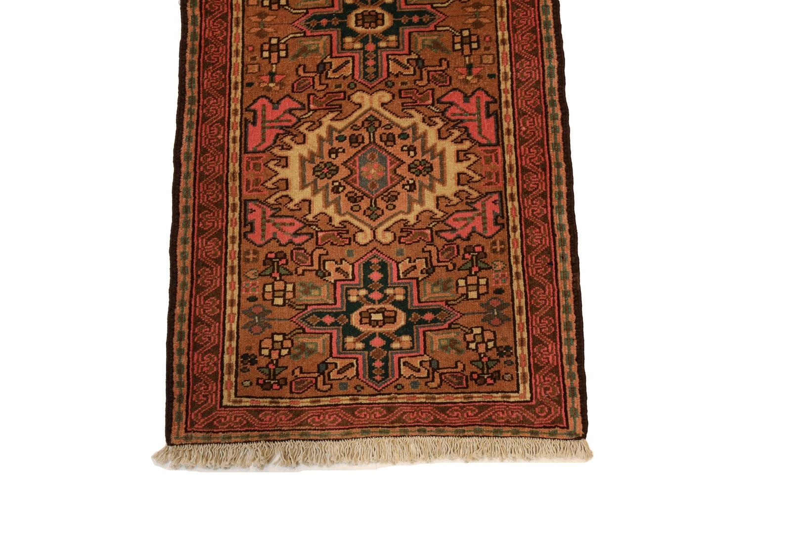 Introducing the Kareje Runner, a captivating masterpiece that effortlessly blends traditional elegance with a touch of unconventional charm. This handmade rug boasts a faded red/rust background, setting the stage for an alternating medallion design