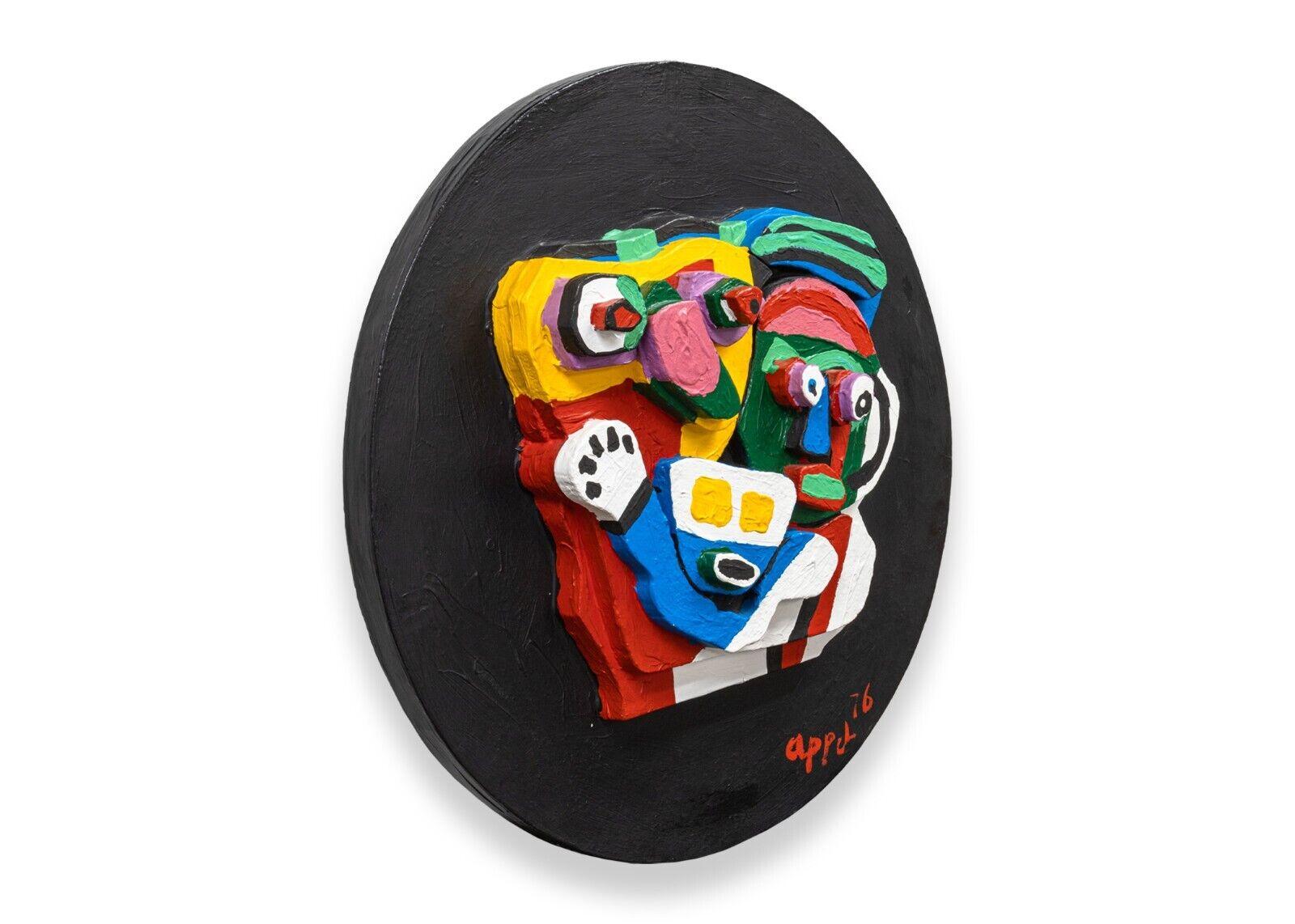 A whimsical hand-painted multiple stone sculpture titled 