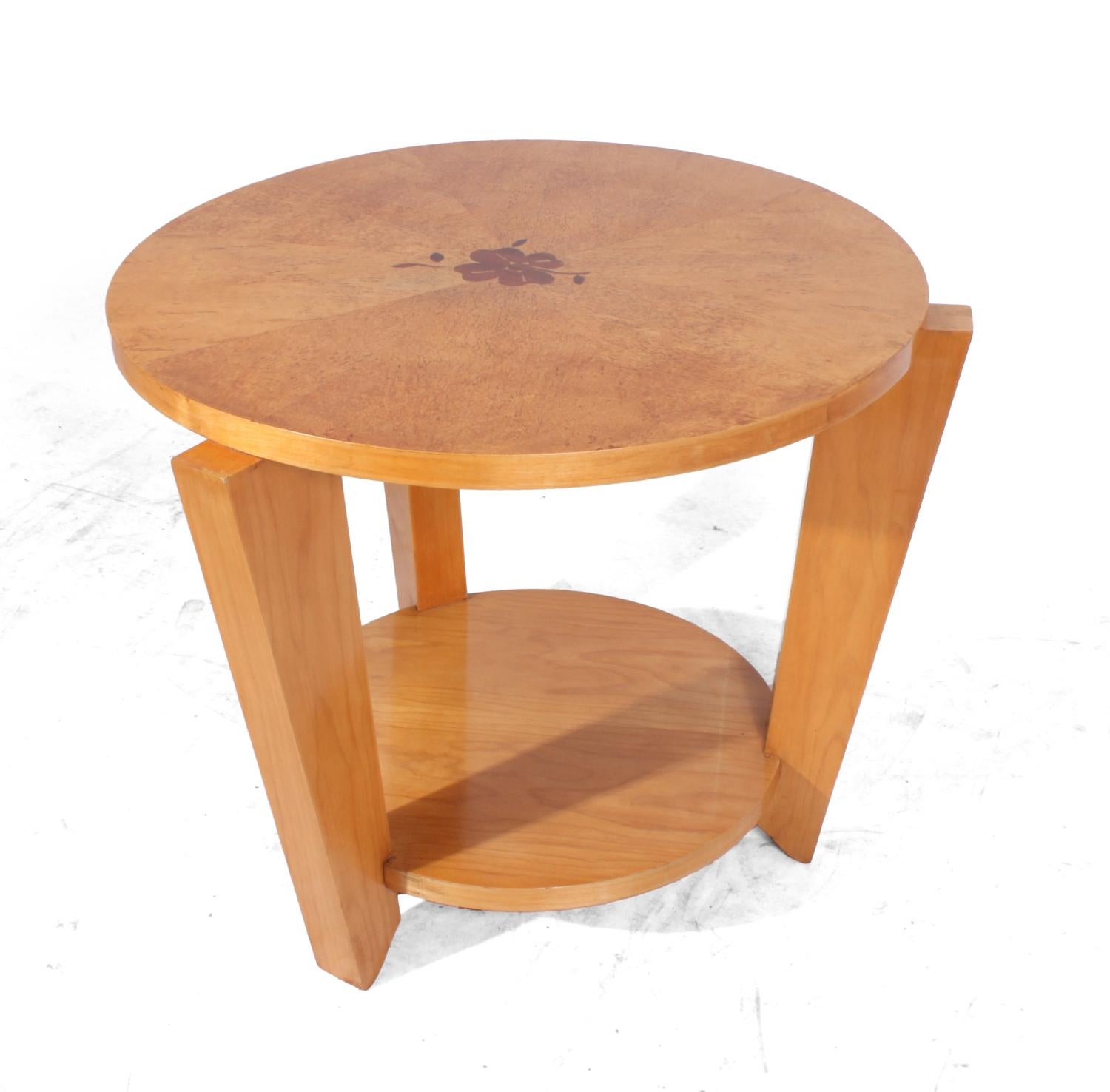 Karelian birch Art Deco occasional table
A very stylish little table with a Karelian birch top with inlaid flower motif in the centre this table has been fully hand polished and is in excellent condition throughout.

Age: 1950

Style: Art