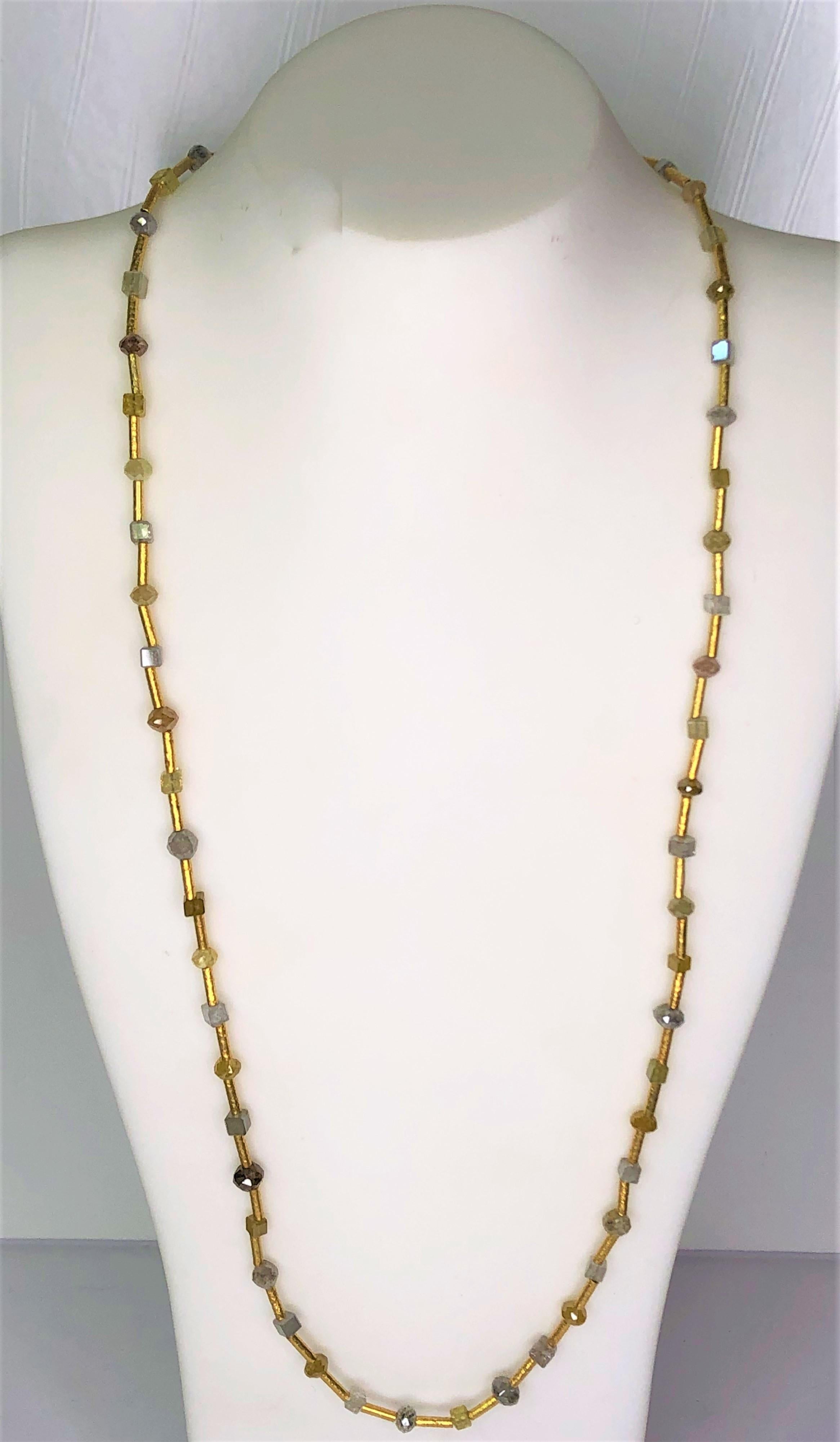This is true to Karen Melfi's design.  It is simply elegant, made with the best gold and style!
This easy to wear necklace is an everyday wearable necklace.
20 karat yellow gold tubes between natural color diamonds.
Multi-color diamonds in bead and