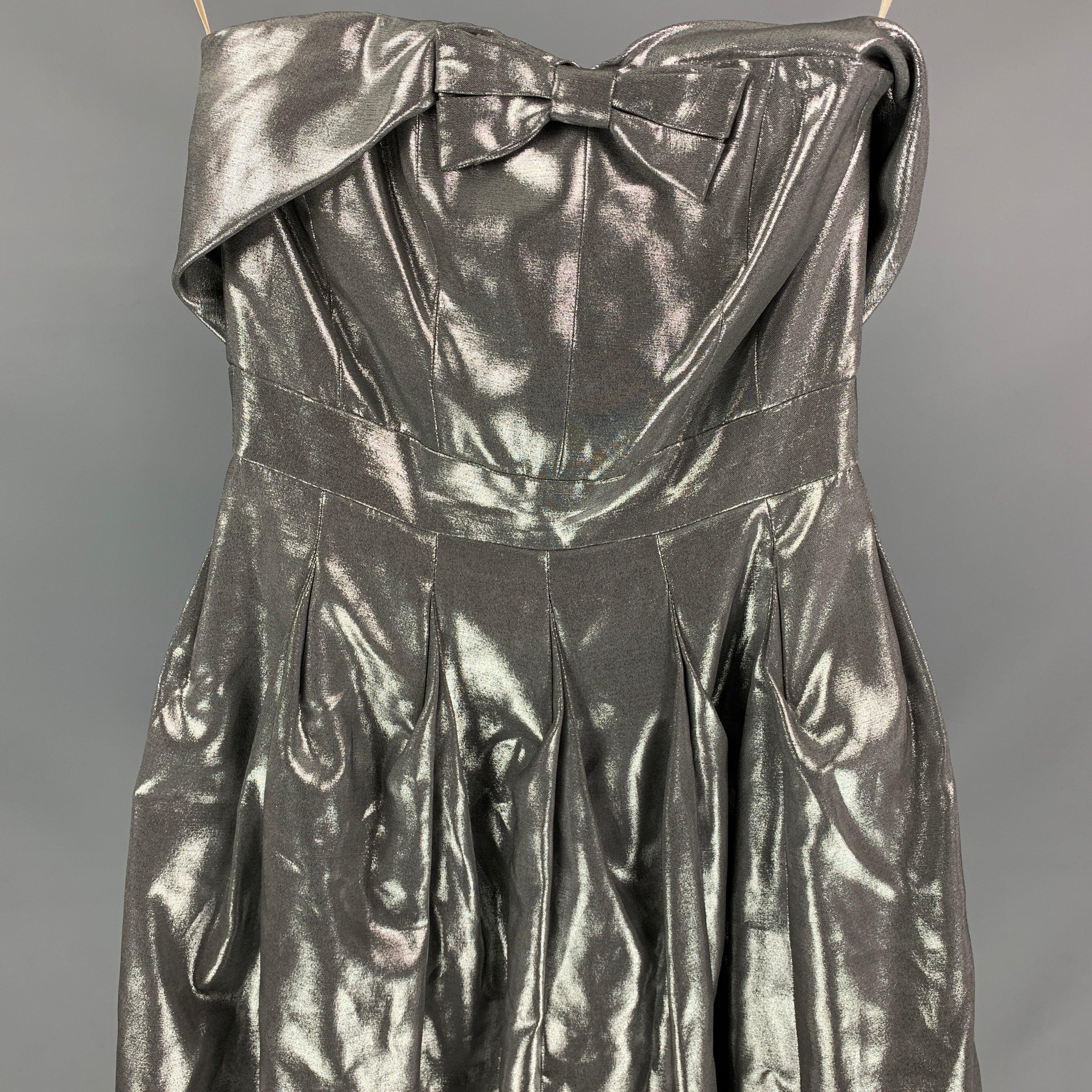 KAREN MILLEN dress comes in a silver metallic viscose blend featuring a pleated style, strapless, front bow detail, a-line, anda back zipper closure.
Very Good
Pre-Owned Condition. 

Marked:   UK 8 / US 4 / EU 36 

Measurements: 
  Bust: 26 inches 
