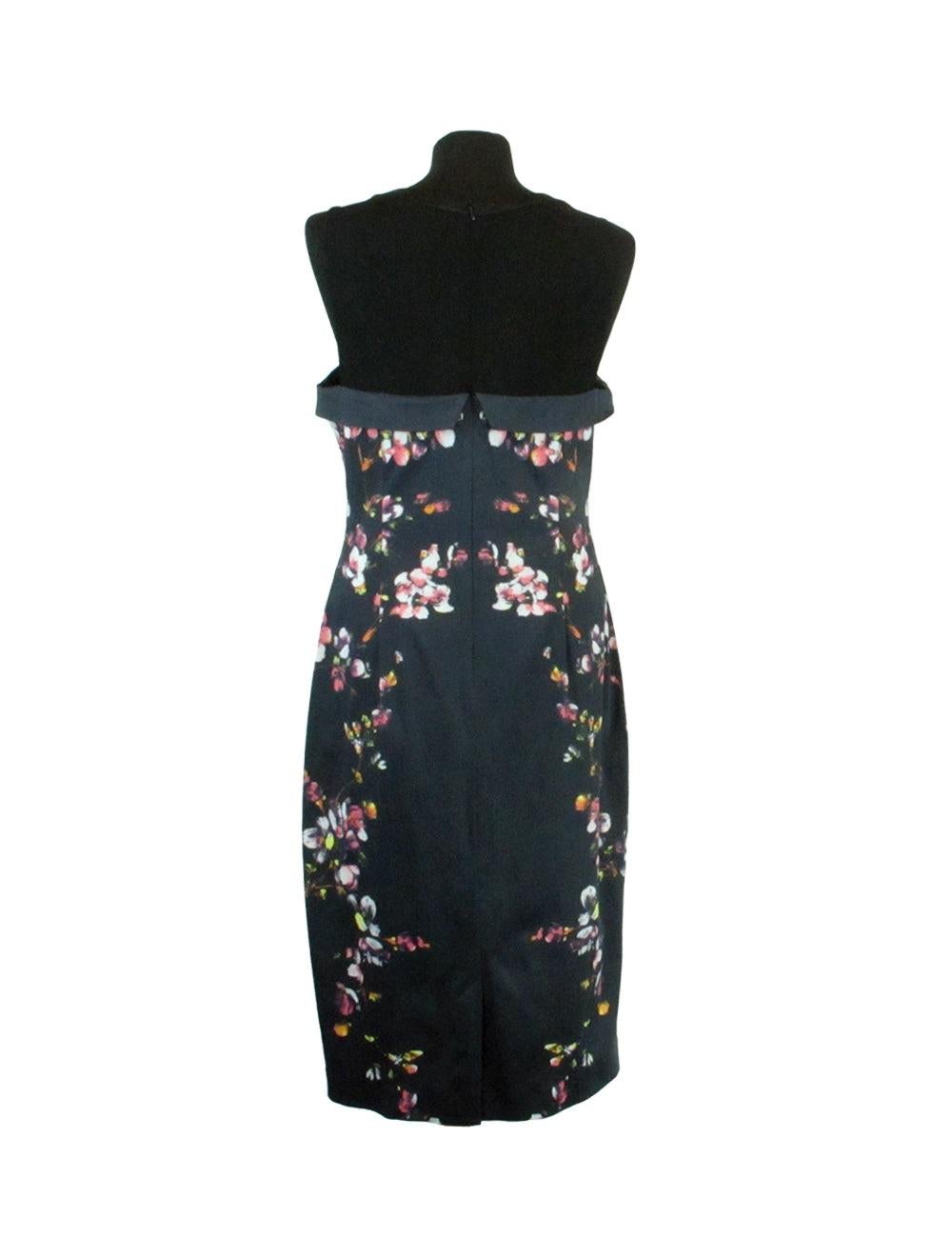 Floral Black a-line Dress Collar Detail.

Additional information:
Material: 71% Acetate / 26% Polyamide / 3% Elastane 
Features: Floral print, Back zipper
Size: UK 16
Overall Condition: Good