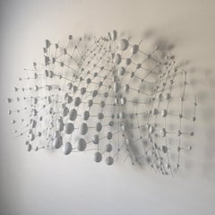 Contemporary white minimalist wall sculpture made from natural materials