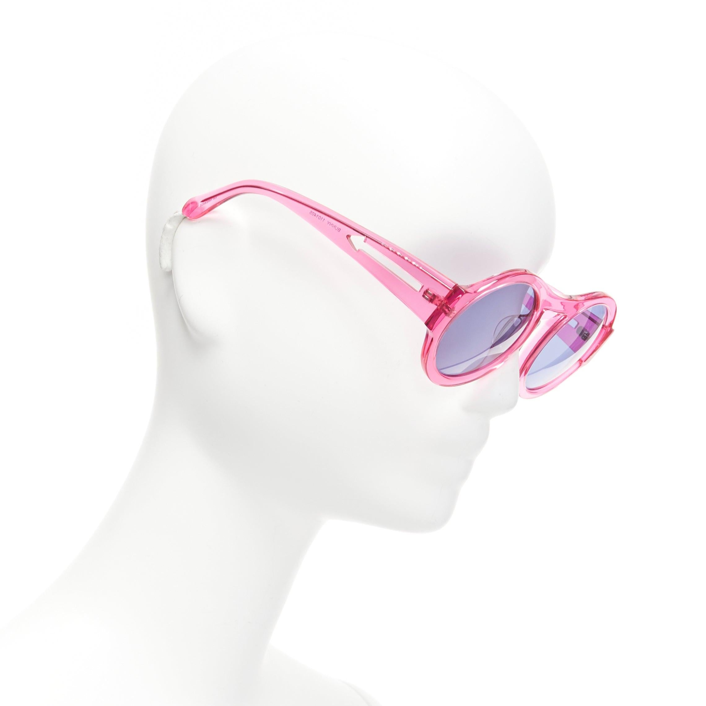 KAREN WALKER Bunny 1101405 clear pink round frame dark blue lens sunglasses
Reference: NKLL/A00088
Brand: Karen Walker
Model: Bunny 1101405
Material: Resin
Color: Pink, Navy
Pattern: Solid
Made in: China

CONDITION:
Condition: Excellent, this item