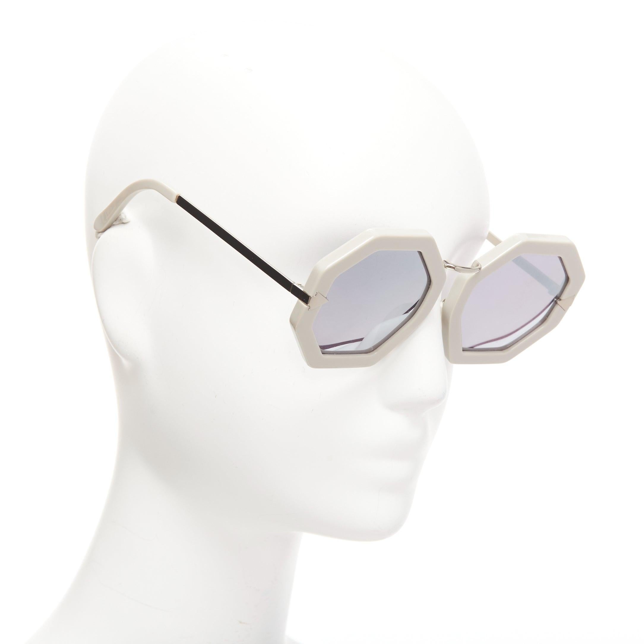 KAREN WALKER Moon Disco grey acetate handmade hexagon arrow sunglasses
Reference: CNPG/A00046
Brand: Karen Walker
Model: Moon Disco
Material: Acetate
Color: Grey, Silver
Pattern: Solid
Lining: Grey Acetate
Extra Details: Signature silver arrows at