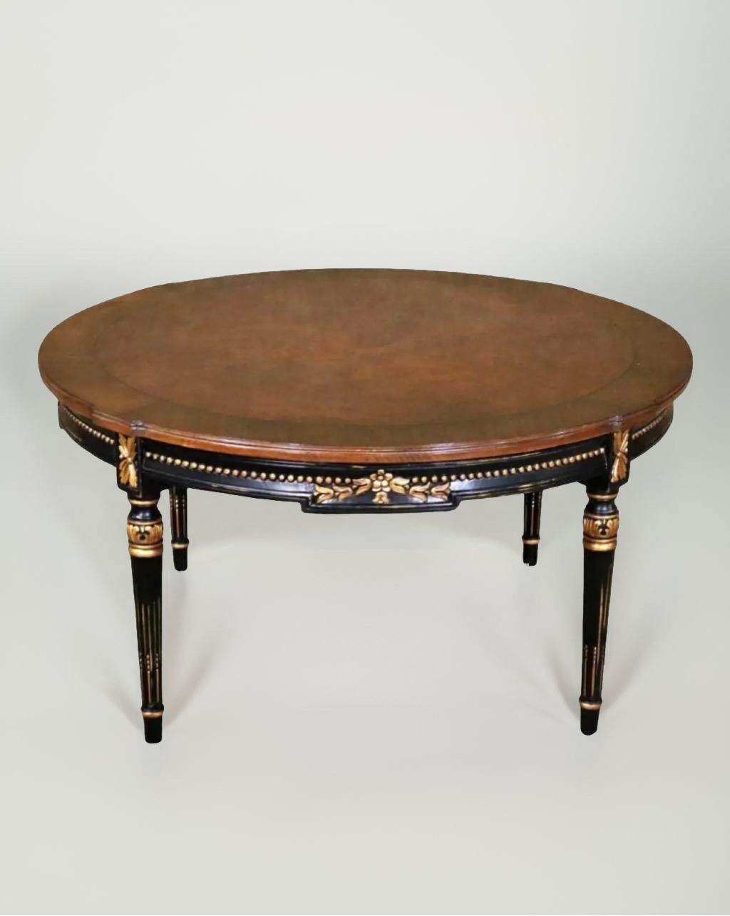Magnificent Directoire cocktail table by Karges Furniture, early 2000s.

This exceptional table celebrates beautifully hand-carved details that include hand-painted gold leaf rosettes, a bead and floral carving on the apron, and fluted legs with a