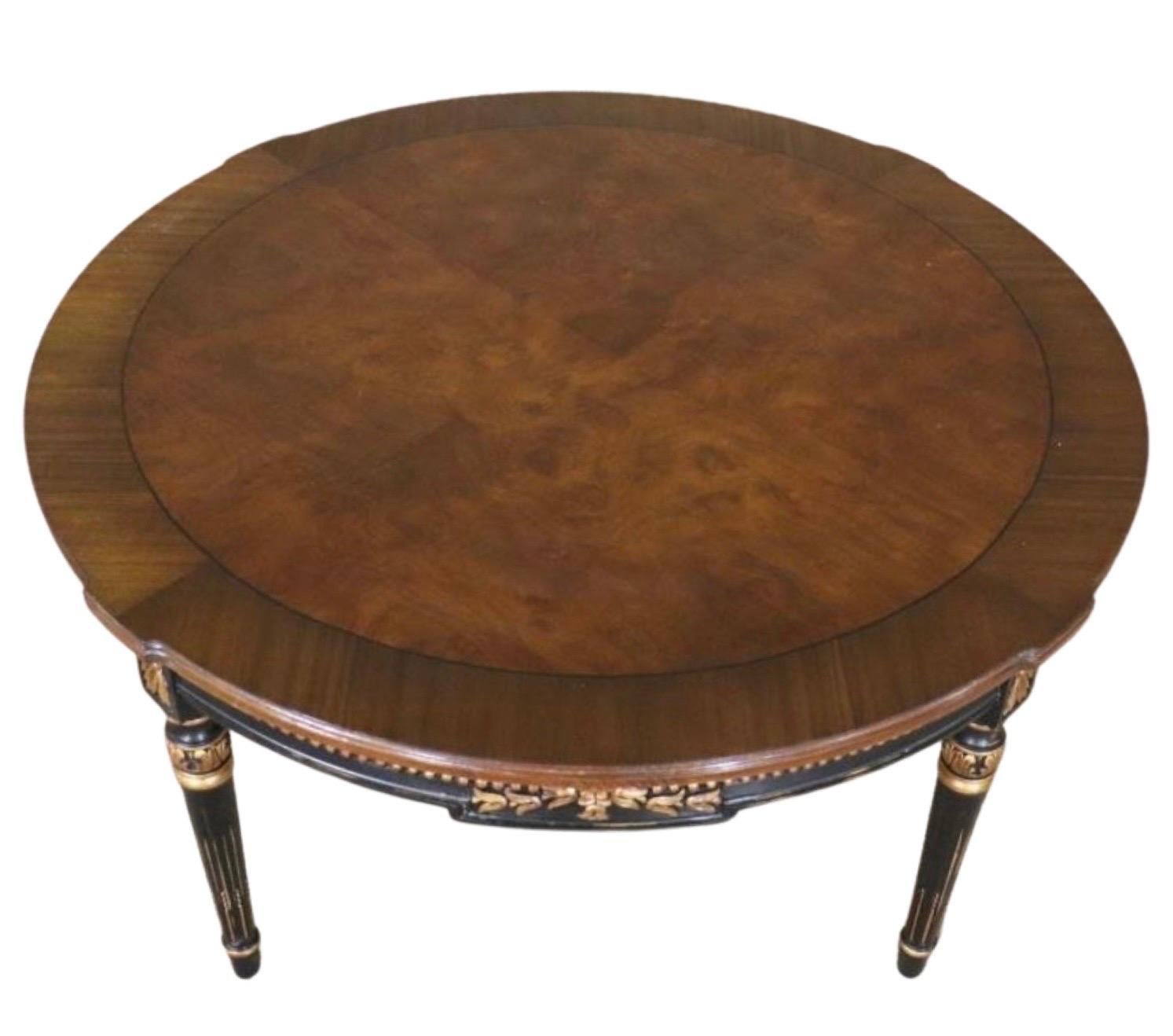 Magnificent Directoire cocktail table by Karges Furniture, early 2000's.

This exceptional table celebrates beautifully hand-carved details that include hand-painted gold leaf rosettes, a bead and floral carving on the apron, and fluted legs with a
