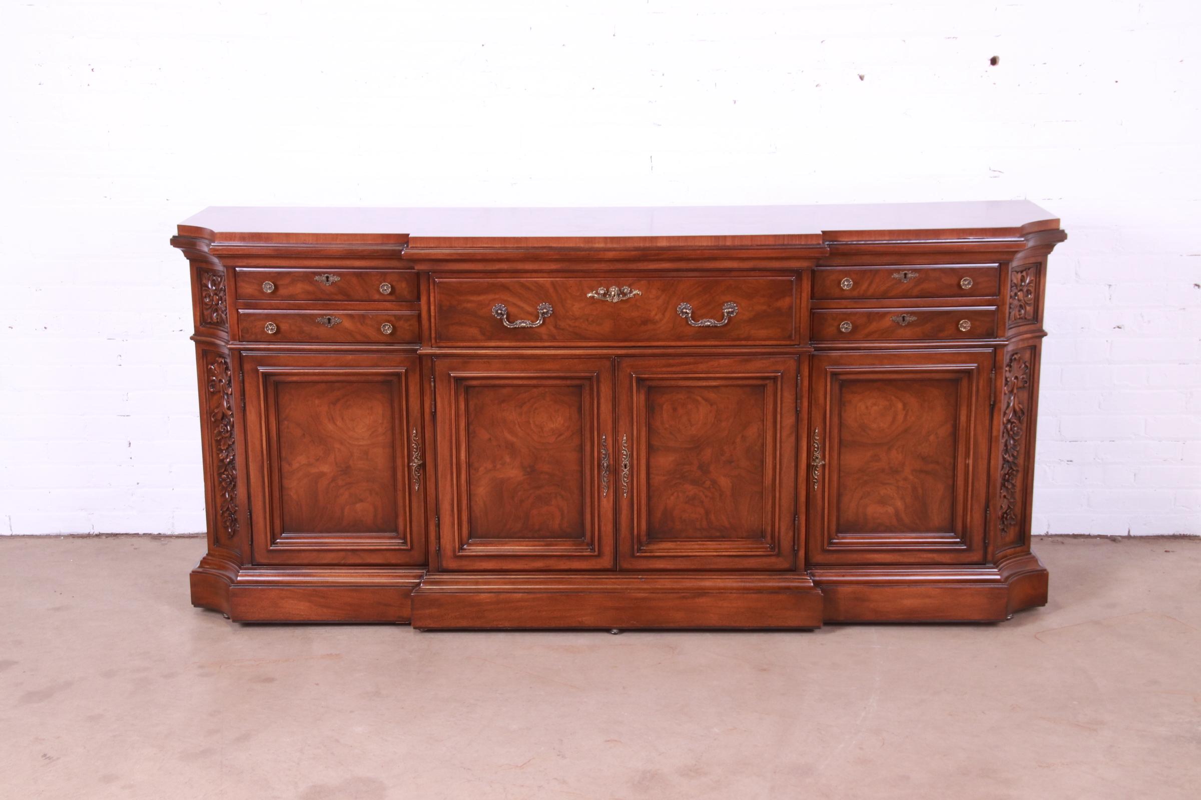 An exceptional French Louis XV style sideboard, credenza, or bar cabinet

By Karges Furniture

USA, Circa 1980s

Gorgeous figural burled walnut, with original brass hardware and felt silverware inserts in two drawers.

Measures: 79.75