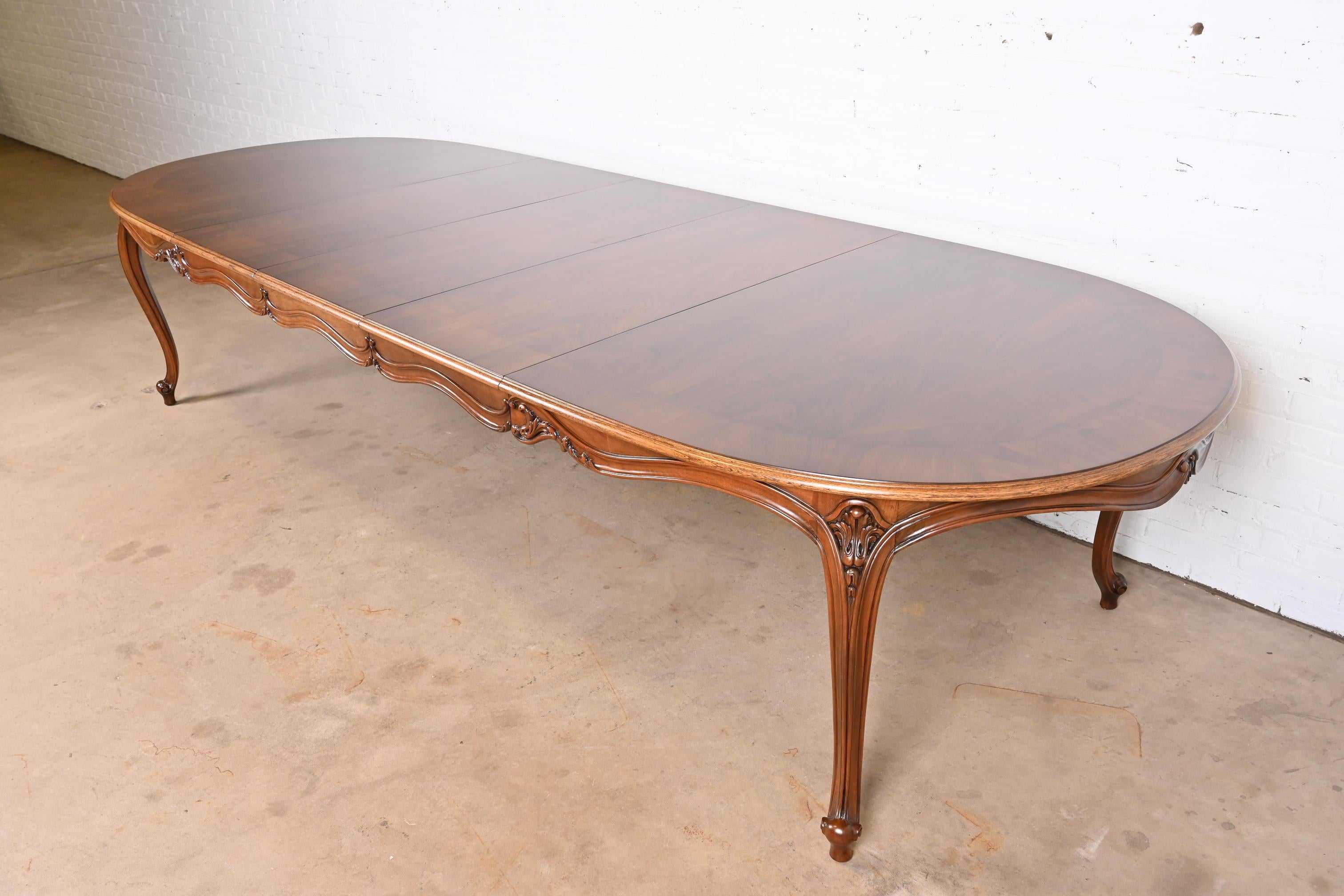 An exceptional French Provincial Louis XV style extension dining table

By Karges Furniture

USA, Circa 1980s

Gorgeous book-matched burled walnut top, with carved solid walnut legs.

Measures: 78.25