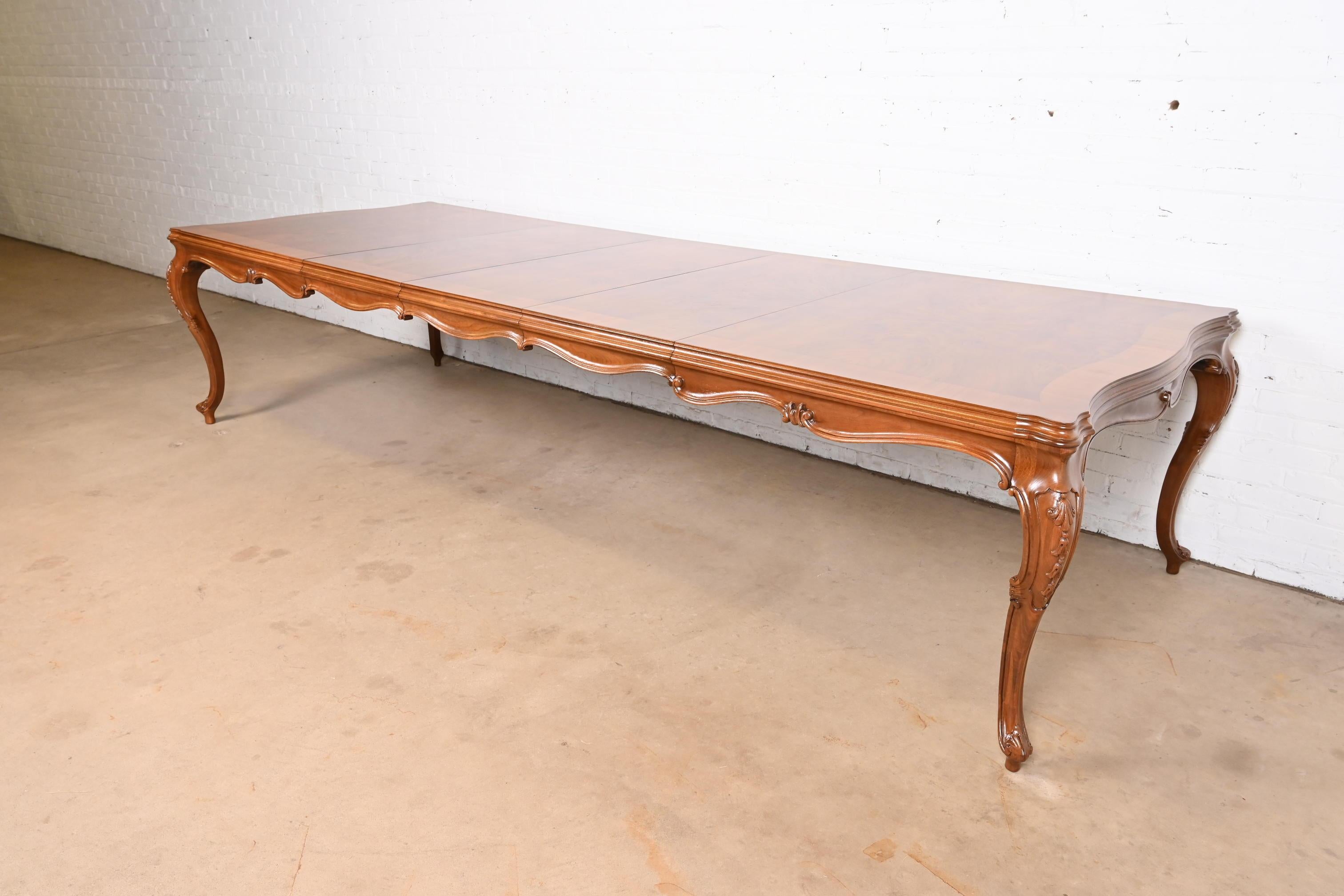 An exceptional French Provincial Louis XV style extension dining table

By Karges Furniture

USA, Circa 1980s

Gorgeous book-matched banded burled walnut top, with carved solid walnut cabriole legs.

Measures: 72