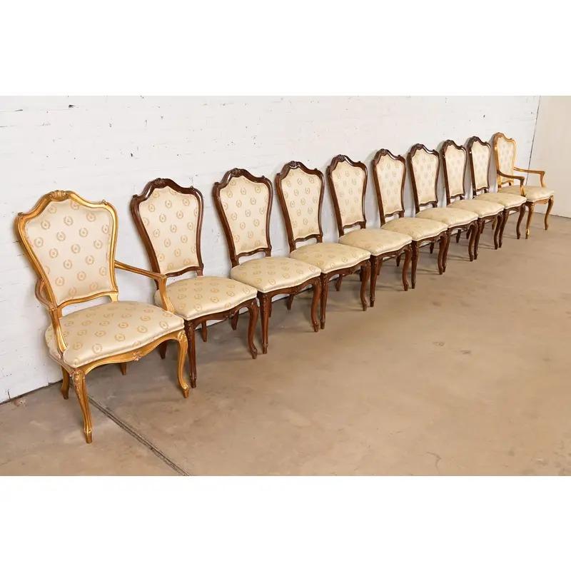 An outstanding set of ten French Rococo or French Provincial Louis XV style dining chairs

By Karges Furniture

USA, Circa 1980s

Gorgeous gold gilt and carved solid walnut frames, with upholstered seats and backs.

Measures: 
Side Chairs - 20