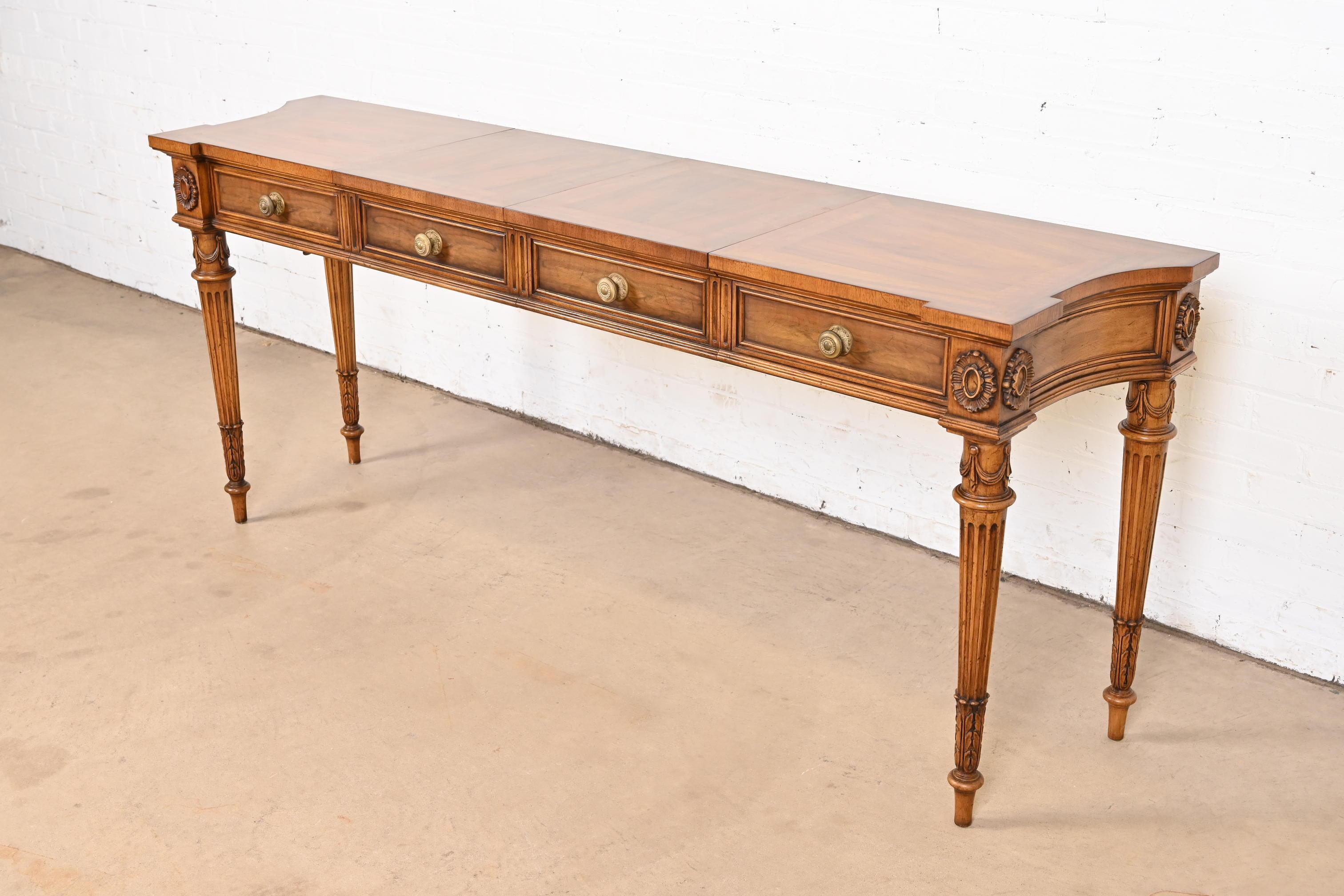 A gorgeous French Regency Louis XVI style extension console table, entry table, or buffet server

By Karges Furniture

USA, Circa 1960s

Beautiful carved burled walnut, with original brass hardware.

Measures: 44.13