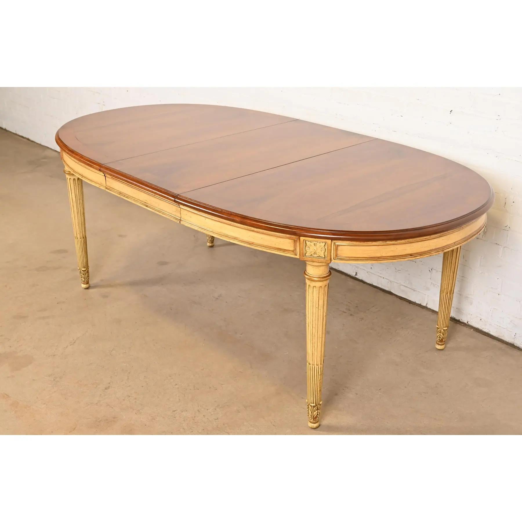 An exceptional French Regency Louis XVI style extension dining table

By Karges Furniture

USA, Circa 1960s

Gorgeous book-matched banded burled walnut top, with cream lacquered and gold gilt apron and legs.

Measures: 60.5