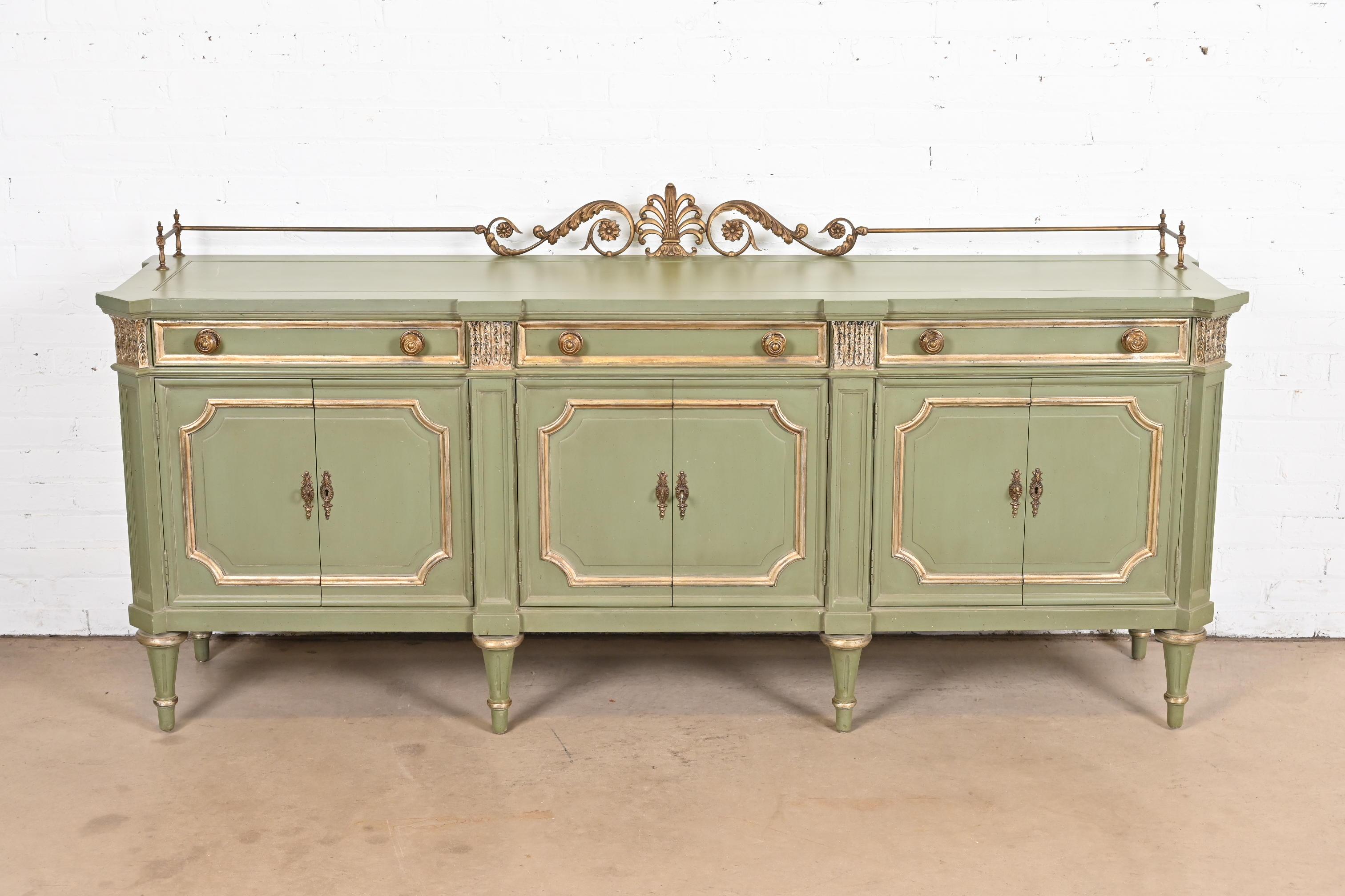 A gorgeous French Regency Louis XVI style sideboard, credenza, or bar cabinet

By Karges

USA, Circa 1960s

Green lacquered walnut, with gold gilt accents, and original brass hardware and gallery.

Measures: 80
