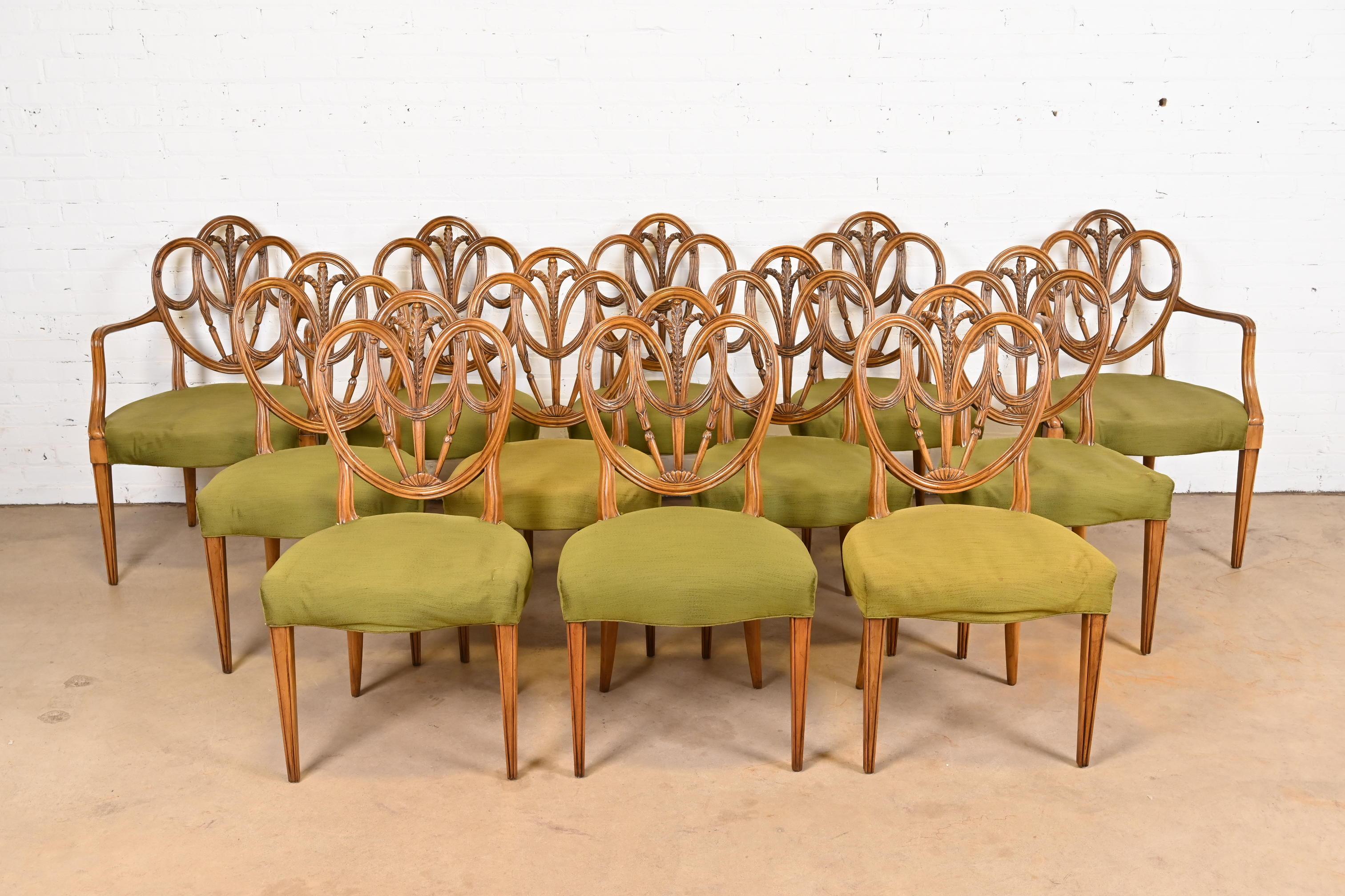 A gorgeous set of twelve French Regency Louis XVI style dining chairs

By Karges Furniture

USA, Circa 1960s

Gorgeous carved solid walnut frames, with green upholstered seats.

Measures:
Side chairs - 20.5