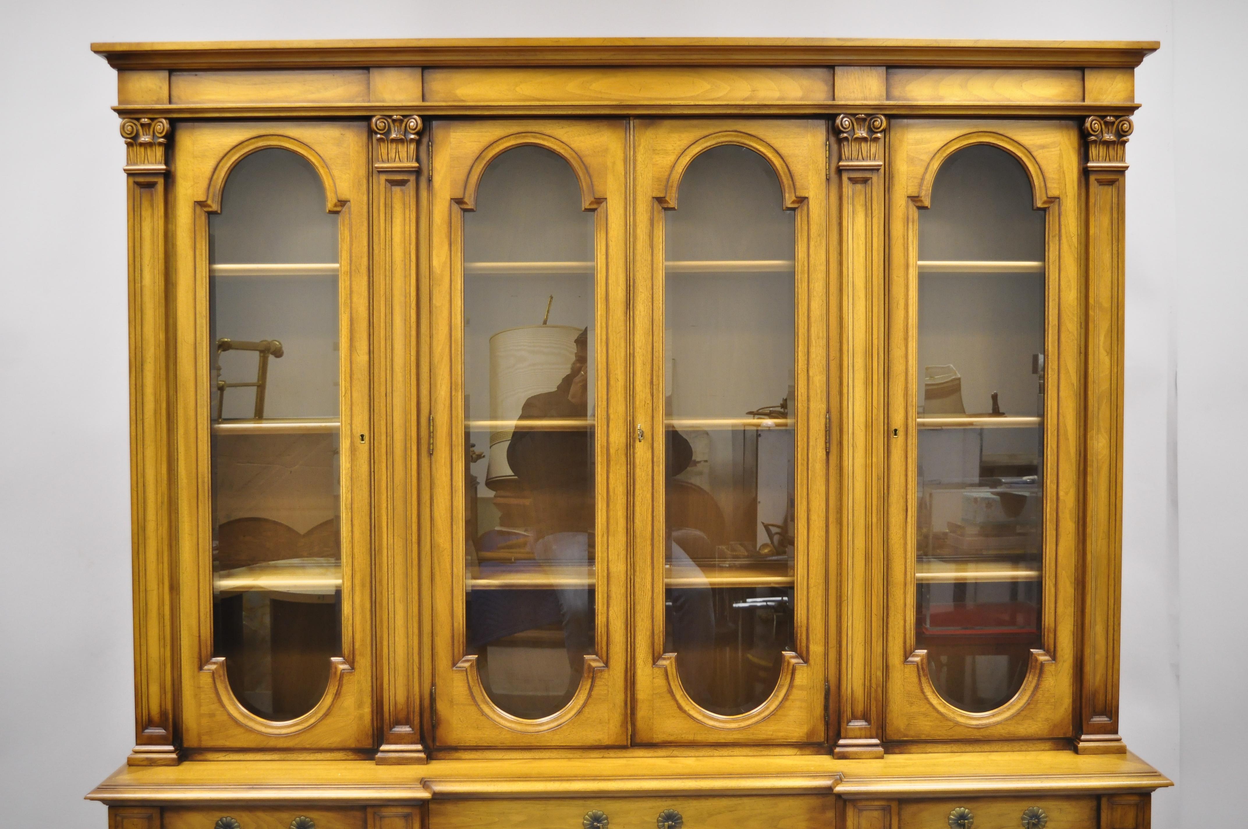 Karges Italian Provincial large fruitwood burl wood breakfront China cabinet. Listing includes beveled glass panels, carved Corinthian columns, beautiful wood grain, 2 part construction, 8 swing doors, original label, working lock and key, 3