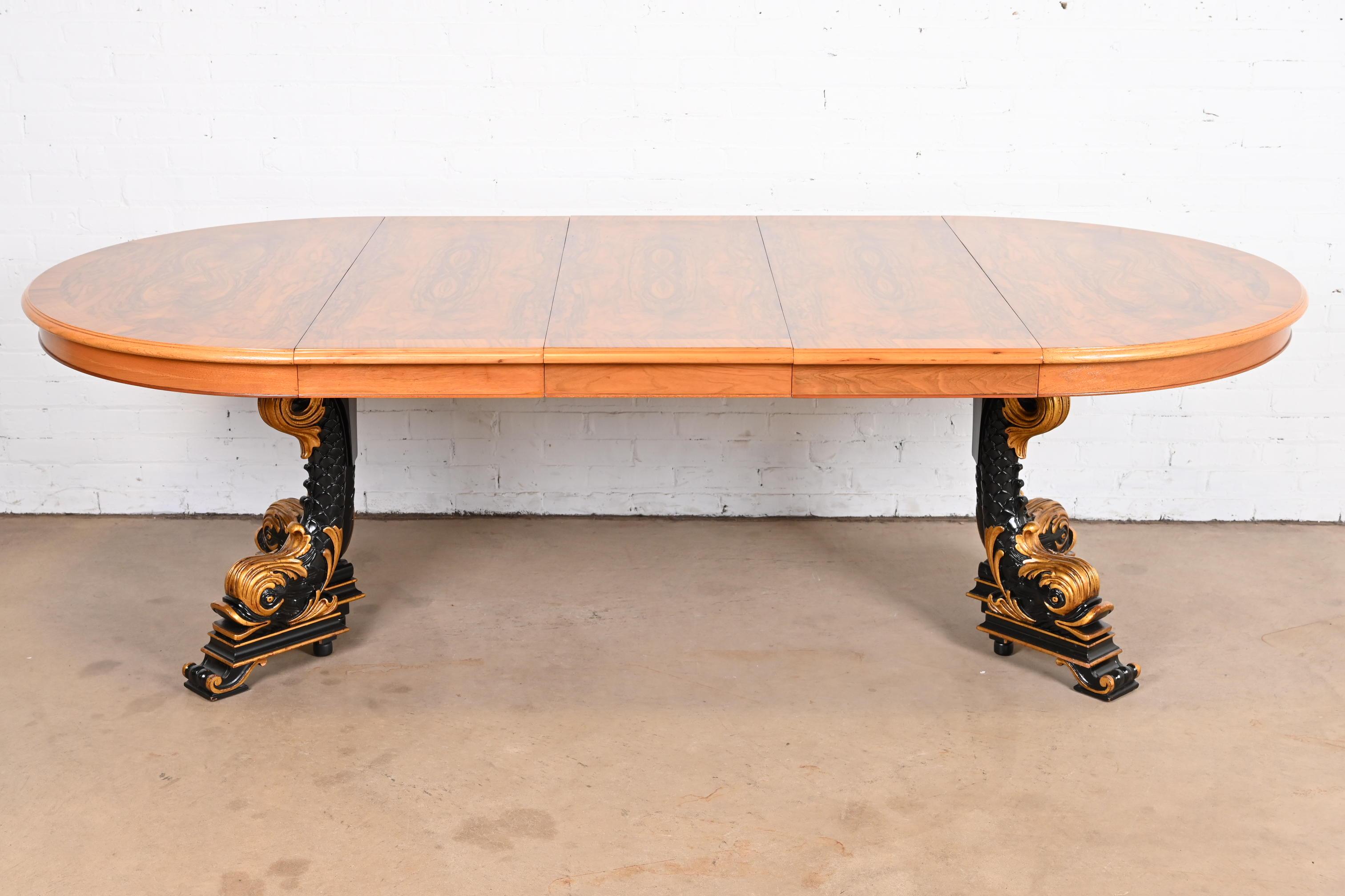 An exceptional Regency or neoclassical style extension pedestal dining table

By Karges Furniture

USA, circa 1980s

Gorgeous book-matched banded burled walnut top, with carved solid hardwood ebonized and gold gilt split pedestal in the iconic