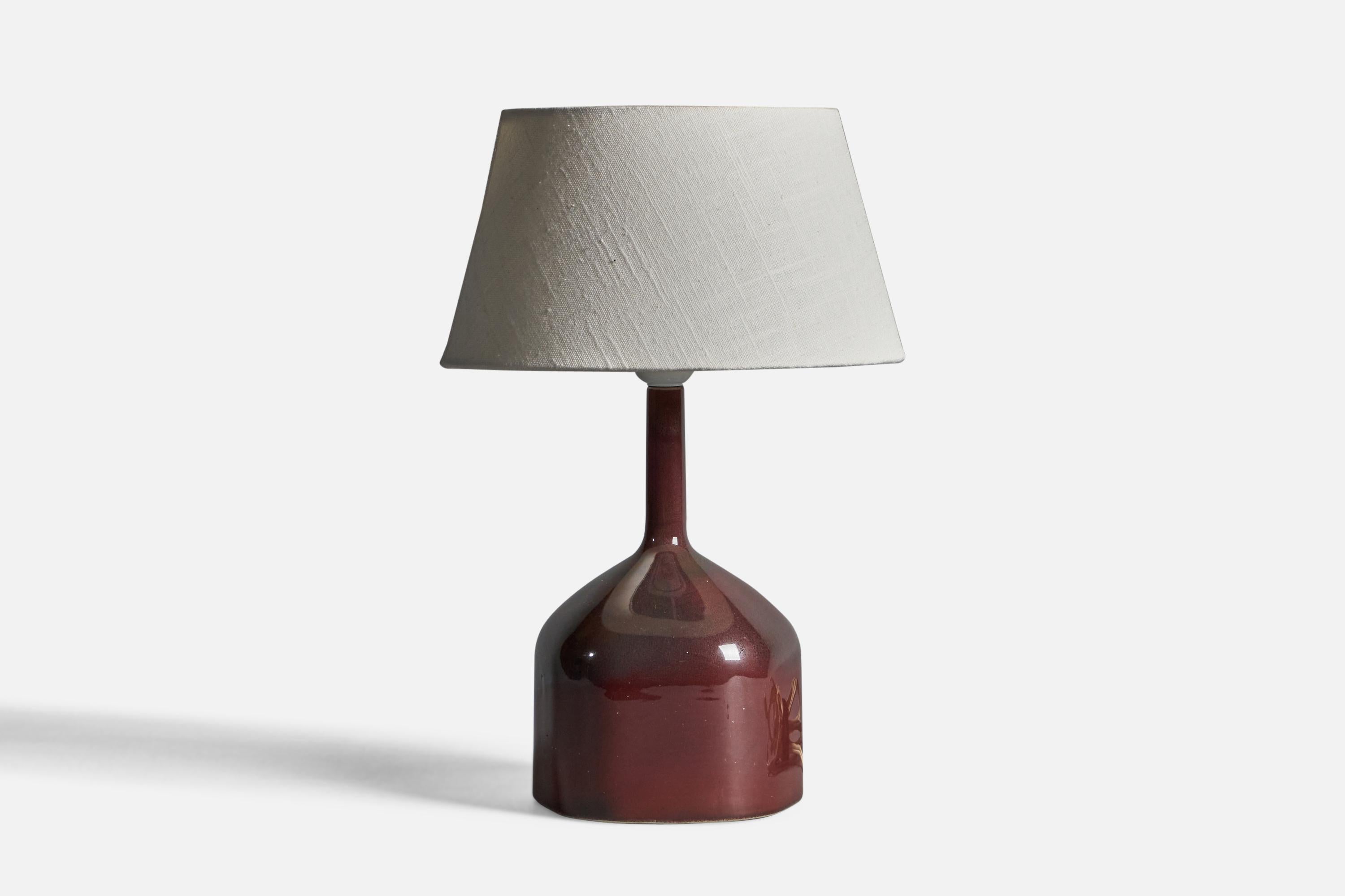 A brown-glazed stoneware and fabric table lamp, designed by Karin Björquist and produced by Gustavsbergs, Sweden, 1960s.

Overall Dimensions (inches): 15.25