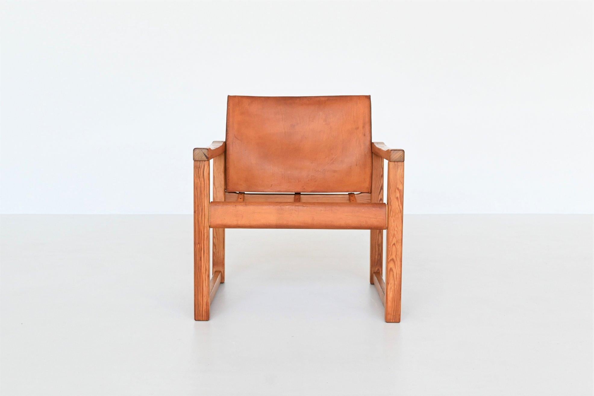 Beautiful elegant Safari lounge chair model Diana designed by Karin Mobring for IKEA, Sweden 1970. This chair has a solid pine wooden frame with original cognac saddle leather seating. The straps at the back give the chairs a particularly tough