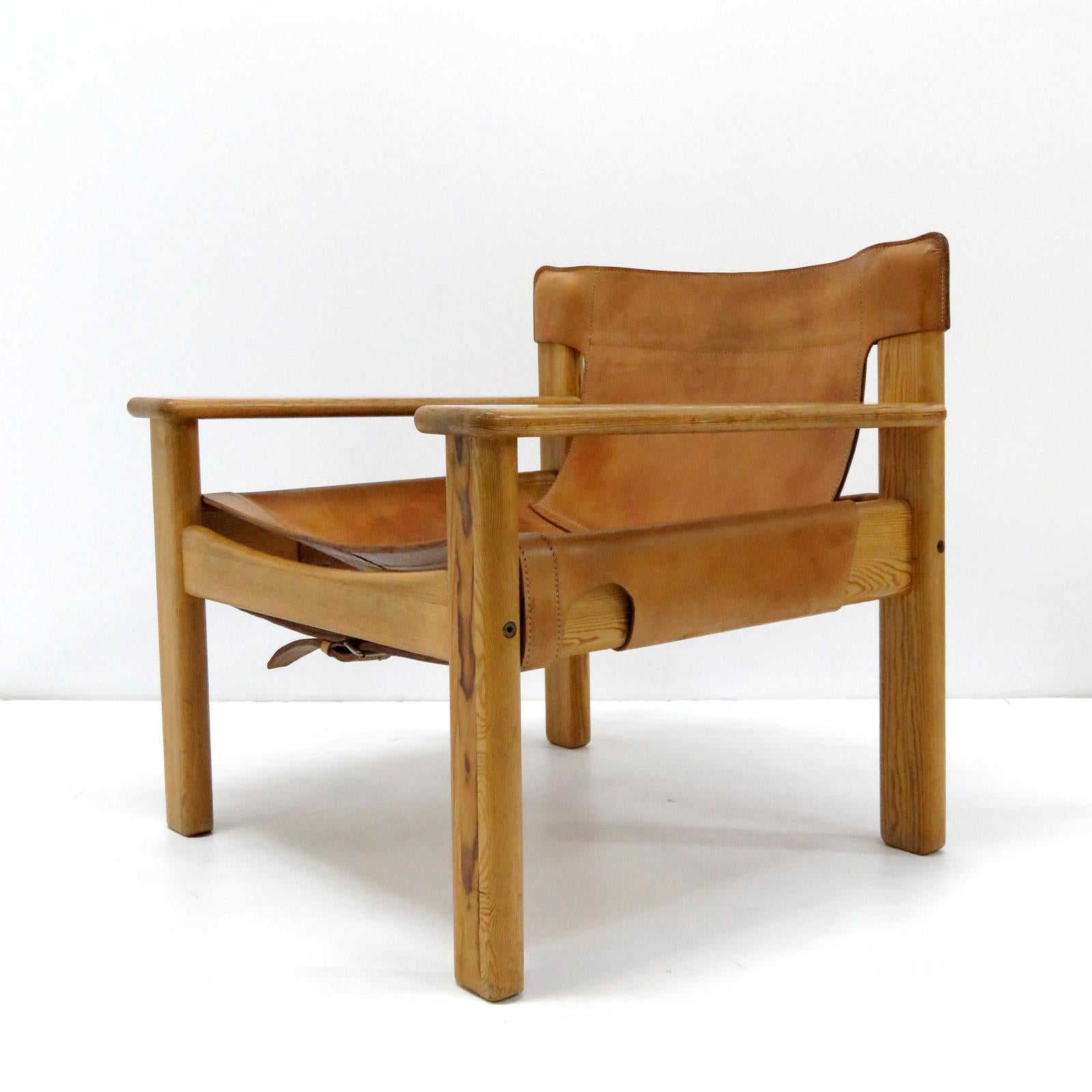 Bold and comfortable Danish modern lounge chairs by Karin Mobring, Sweden, designed in 1977, oversized pine frame with thick cognac colored leather with incredible patina.