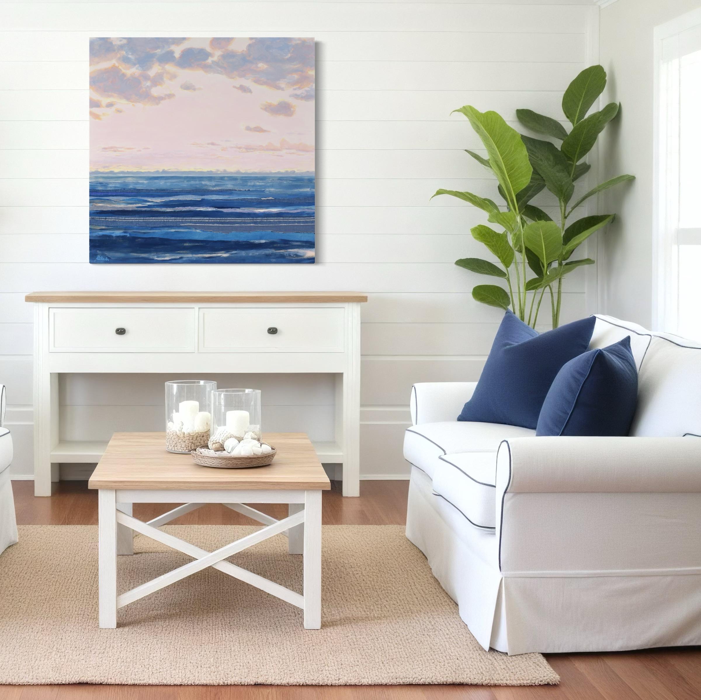 This contemporary abstract painting by Karin Olah, titled Chambray Sea 12, captures the quiet drama of an ocean horizon beneath a luminous sky. The composition layers acrylic paint and hand-stitched textiles on linen to evoke the soft texture of