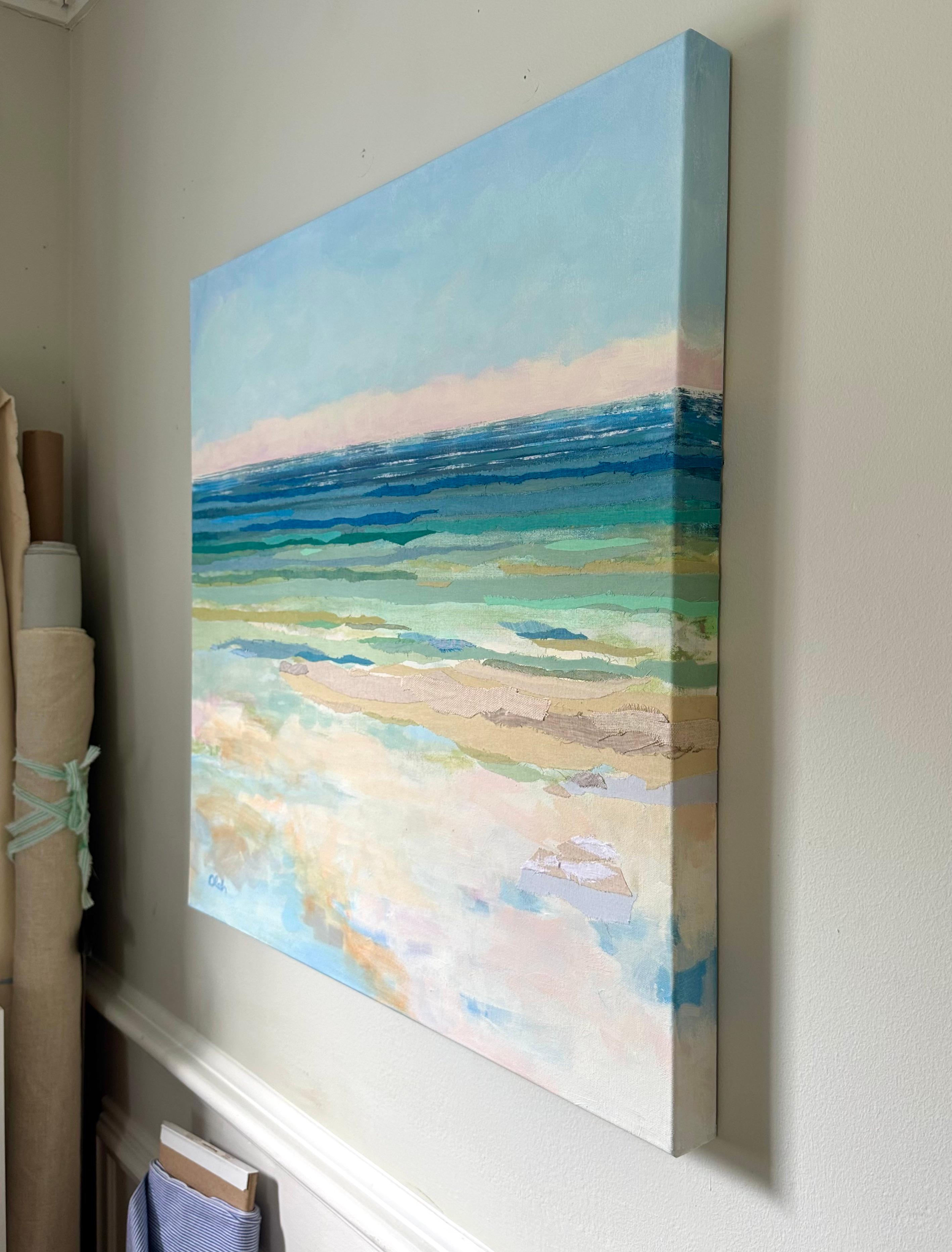 This contemporary abstract painting by Karin Olah captures the layered serenity of a shoreline meeting the sea. Blending acrylic paint with hand-dyed textiles, the composition presents a luminous horizon where tranquil blues, teals, and sandy