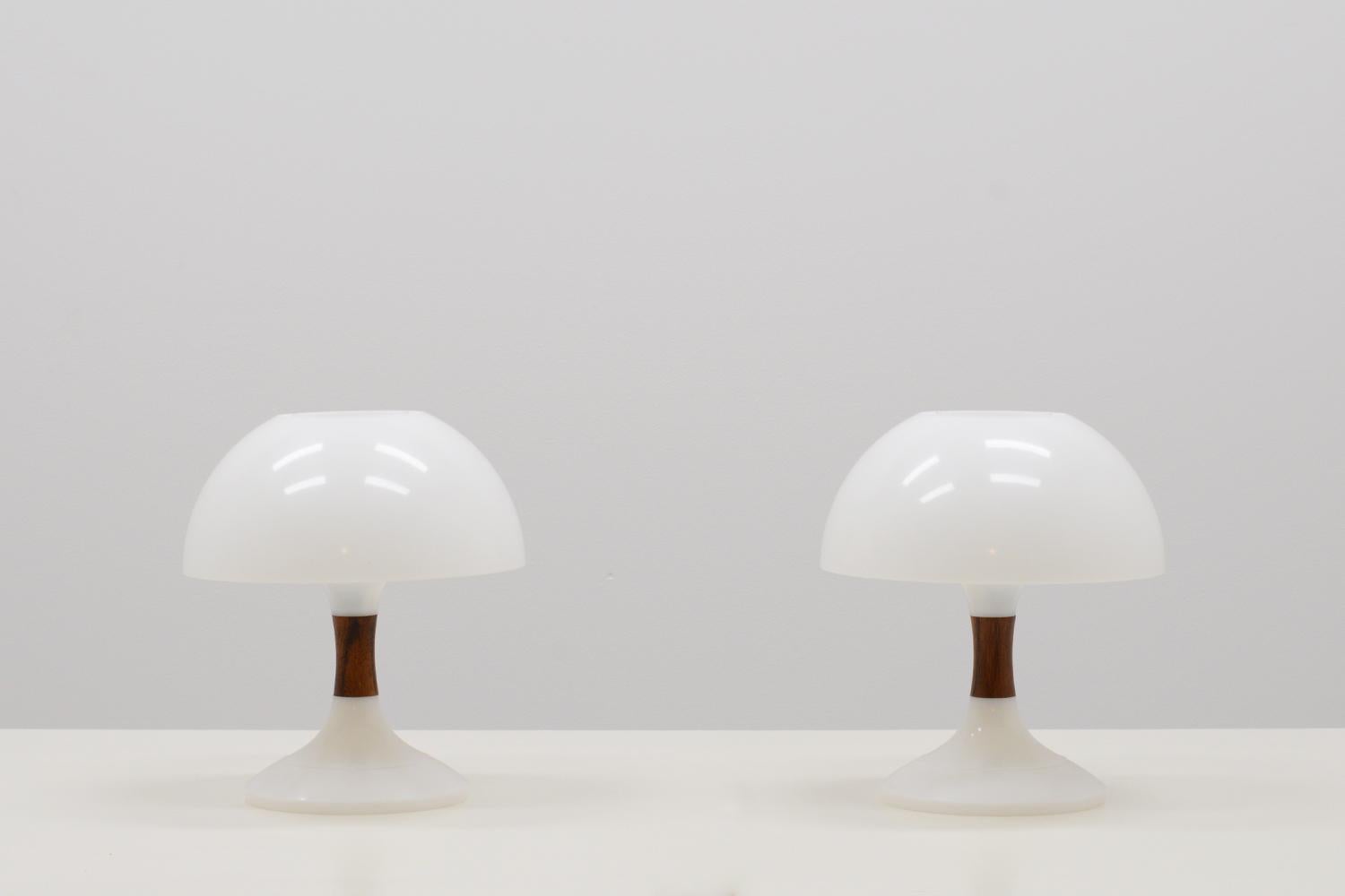 Set of 2 rare “Karina” table lamps by Bent Karlby for ASK Belysninger 1971. Typical space age design. Made of acrylic and rosewood in the middle. In very good vintage condition. Price for the set of 2.