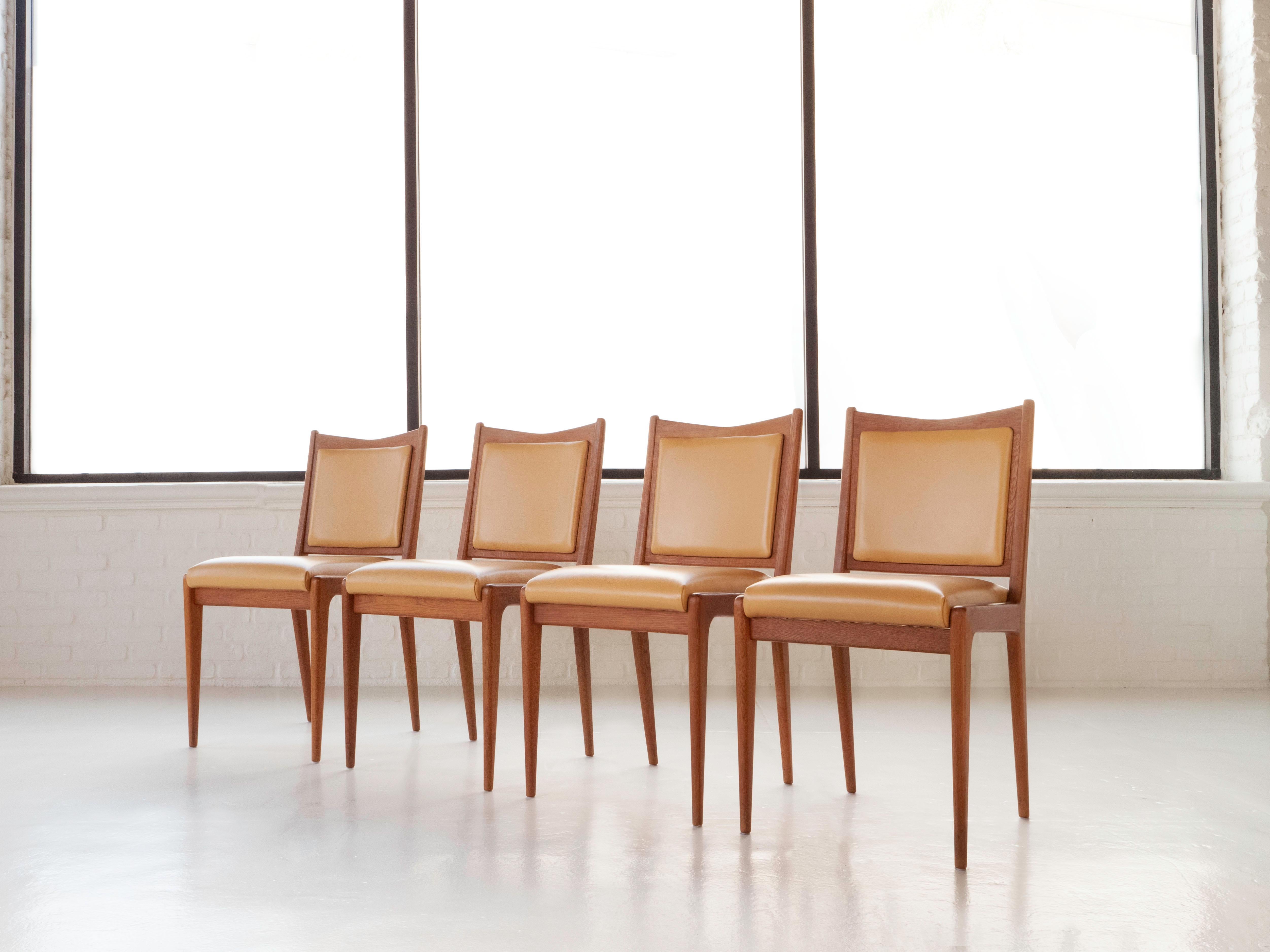 Set of 6 dining chairs by designer Karl-Erik Ekselius for JO Carlsson Sweden, 1960's. 

The solid wood frames are red oak, very similar in tone to teak. They are sculpted with sleek lines and slender tapered legs. The grain is very pronounced and