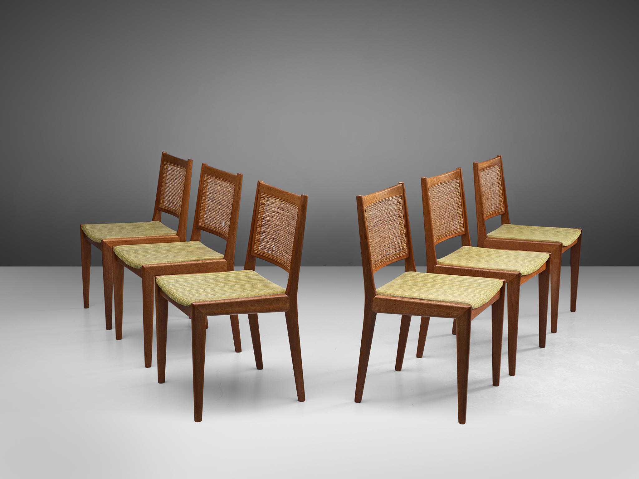 Karl-Erik Ekselius for J.O. Carlsson, set of six dining chairs, teak, cane, Denmark, 1950s.

This stately set of six chairs with teak frame has a profiled back with woven cane and a green to white seat with striped upholstery. This set is designed