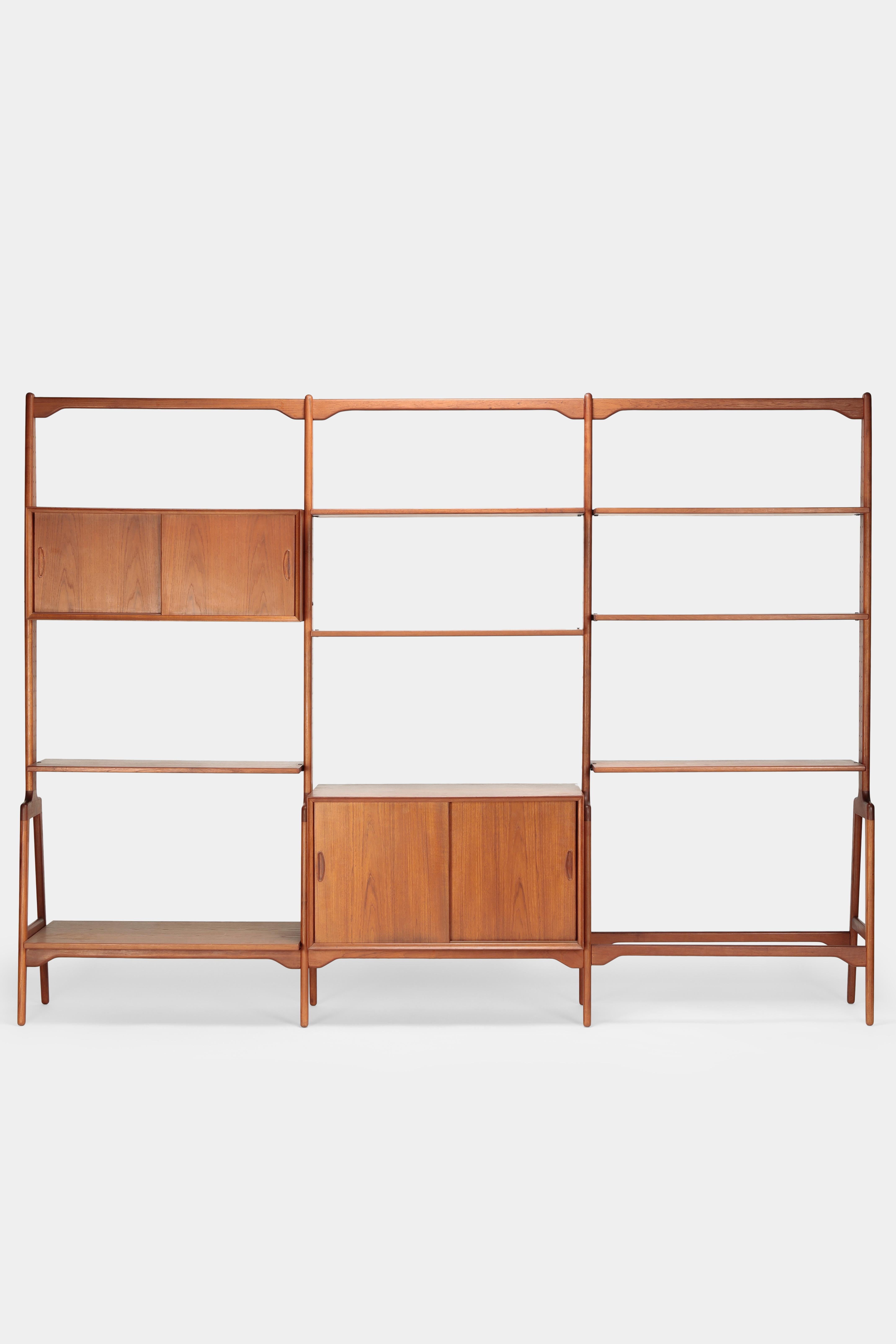 Karl-Erik Ekselius shelving unit manufactured by J.O. Carlson in the 1960s in Sweden. Careful processed shelf made of solid teak wood. Two different cabinets with sliding doors and one shelf each. Can be arranged to your own preference and can also