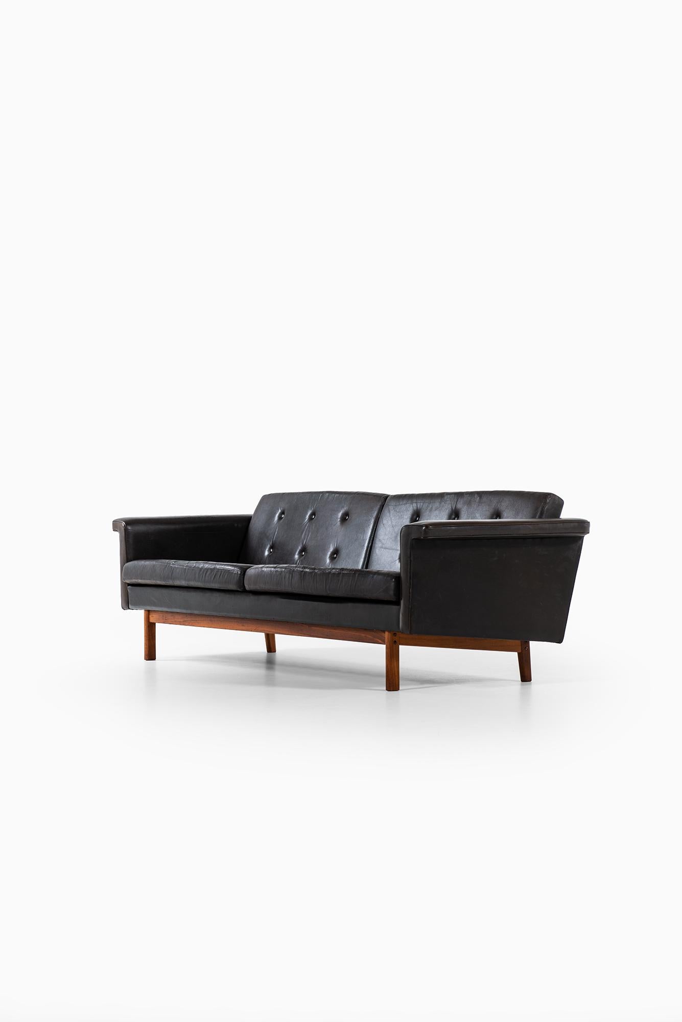 Mid-20th Century Karl-Erik Ekselius sofa in black leather by JOC in Sweden