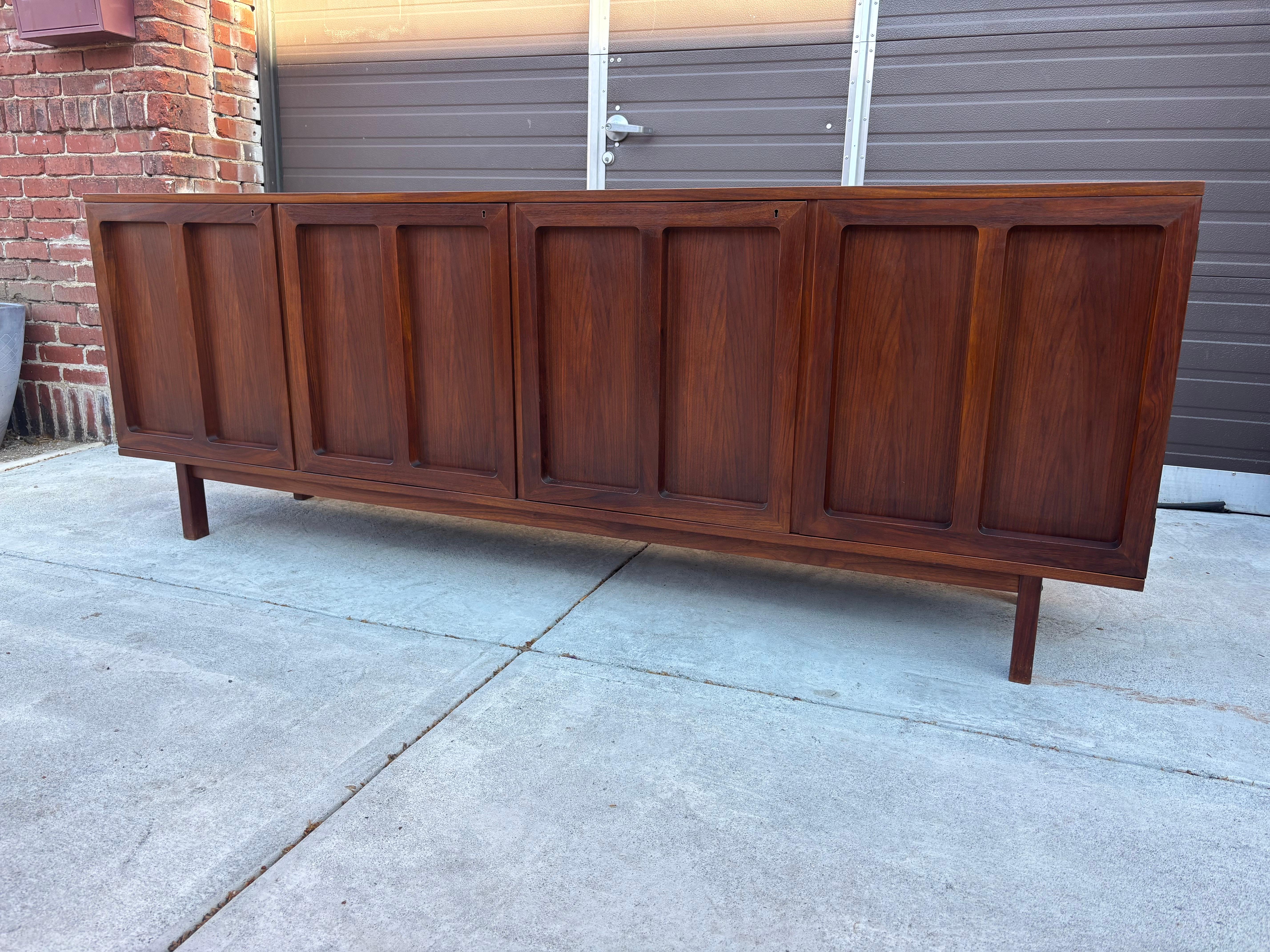 Beautiful 4 Door Cabinet/ Buffet/ Credenza by Karl-Erik Ekselius.  Each door locks making it perfect to store Alcohol and the Family Silver!  One Door opens to reveal pull-out shallow drawers.  Not a typical look!  This one can blend effortlessly