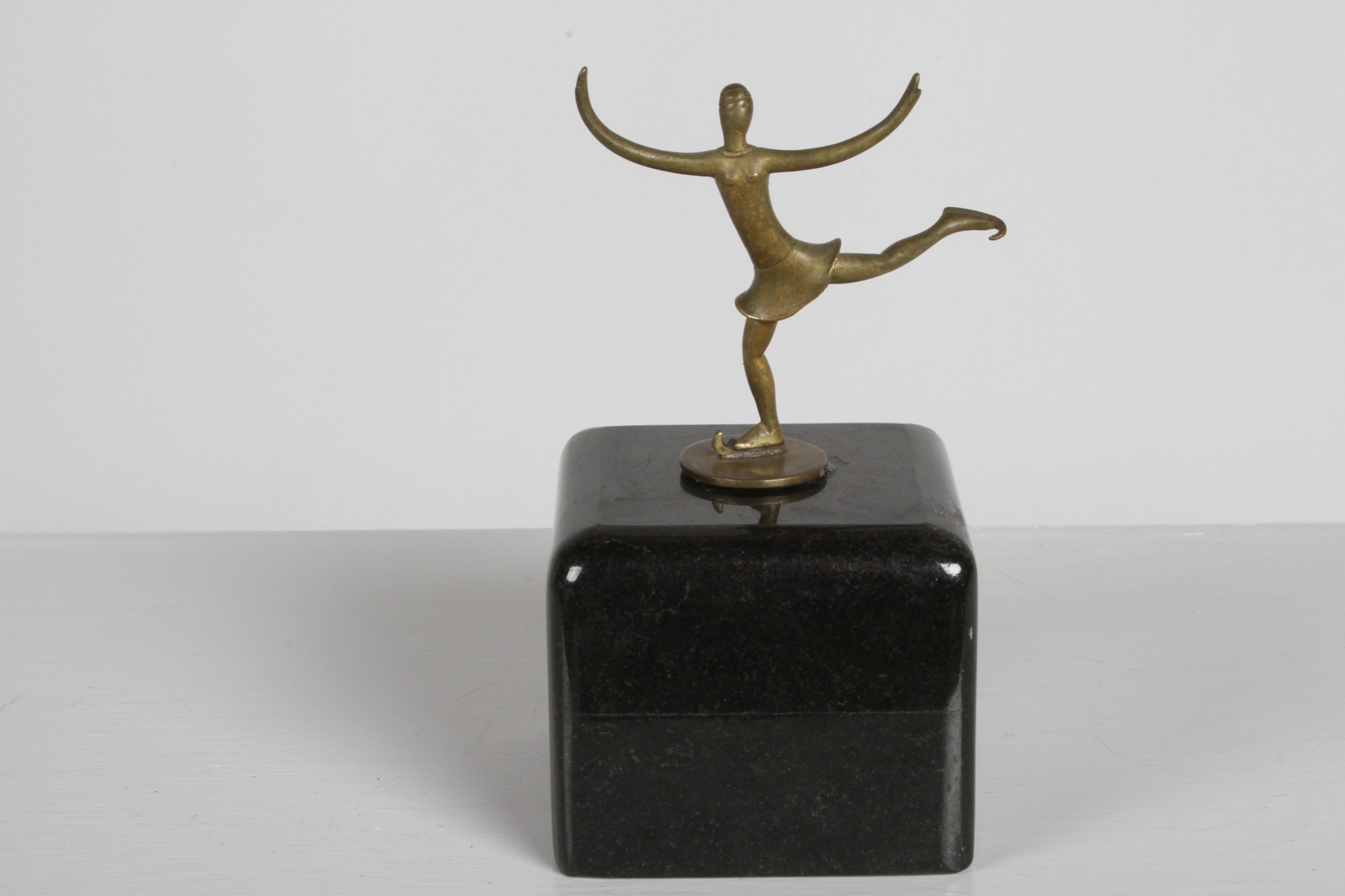 Karl Hagenauer for Werkstätte Hagenauer Wienstamp - stamped WHW made in Austria, circa 1920s bronze miniature female figure ice skater sculpture. Mounted on marble block with museum putty, removable. Mounted by previous owner. Marble base is 3