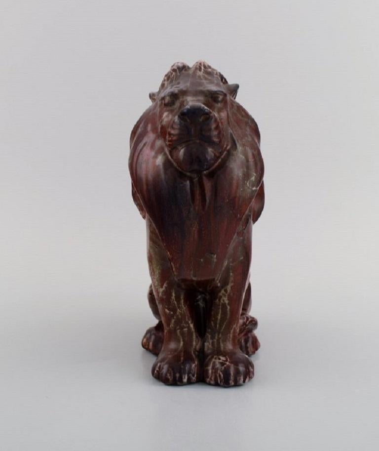 Karl Hansen Reistrup (1863-1929) for Kähler. 
Very rare lion in glazed stoneware. Beautiful ox blood glaze. 
1890s.
Measures: 21.5 x 18 cm.
In excellent condition.
Signed.