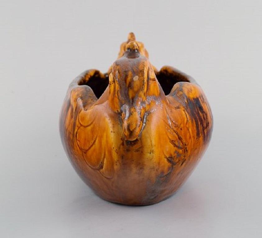Karl Hansen Reistrup for Kähler. Antique bowl in glazed ceramics decorated with ducks. 
Beautiful glaze in orange metallic shades. 1890s.
Measures: 27 x 12.5 x 12.5 cm.
In excellent condition.
Signed: HAK.