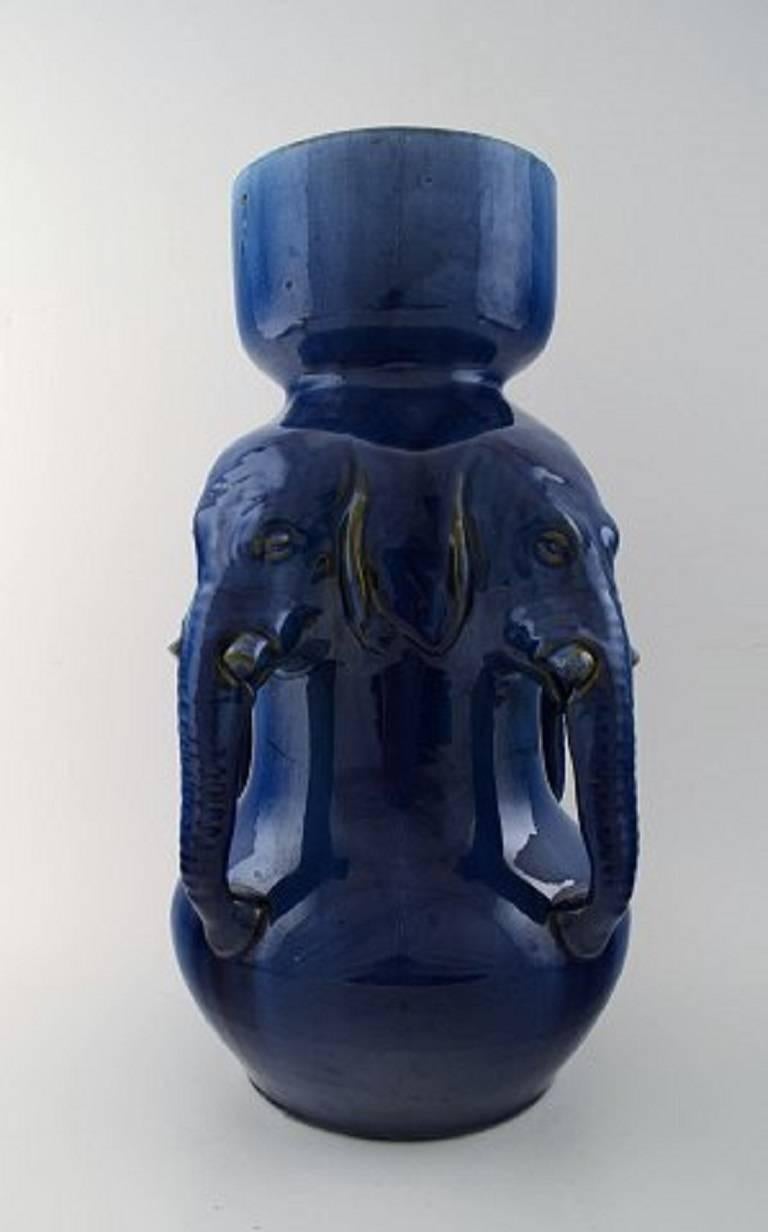 Karl Hansen Reistrup (1863-1929) for Kähler, very large vase of pottery with dark blue glaze, modeled with elephant heads. Approx 1900, Denmark.
Designed by Karl Hansen Reistrup for Kähler.
Signed HAK for Herman A. Kähler, the founder of