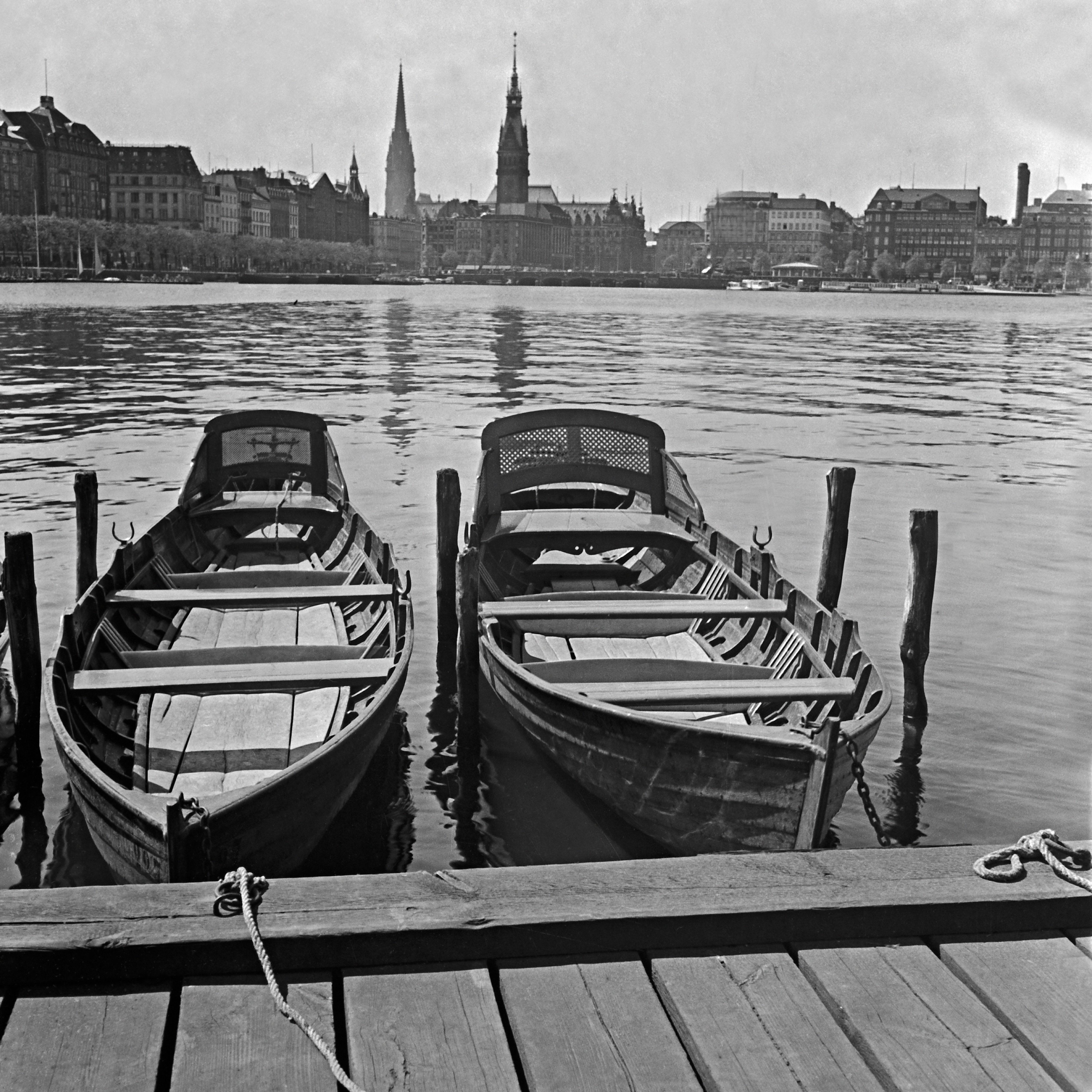 Karl Heinrich Lämmel Black and White Photograph - Boats at quay on Alster view to Hamburg city hall, Germany 1938, Printed Later 