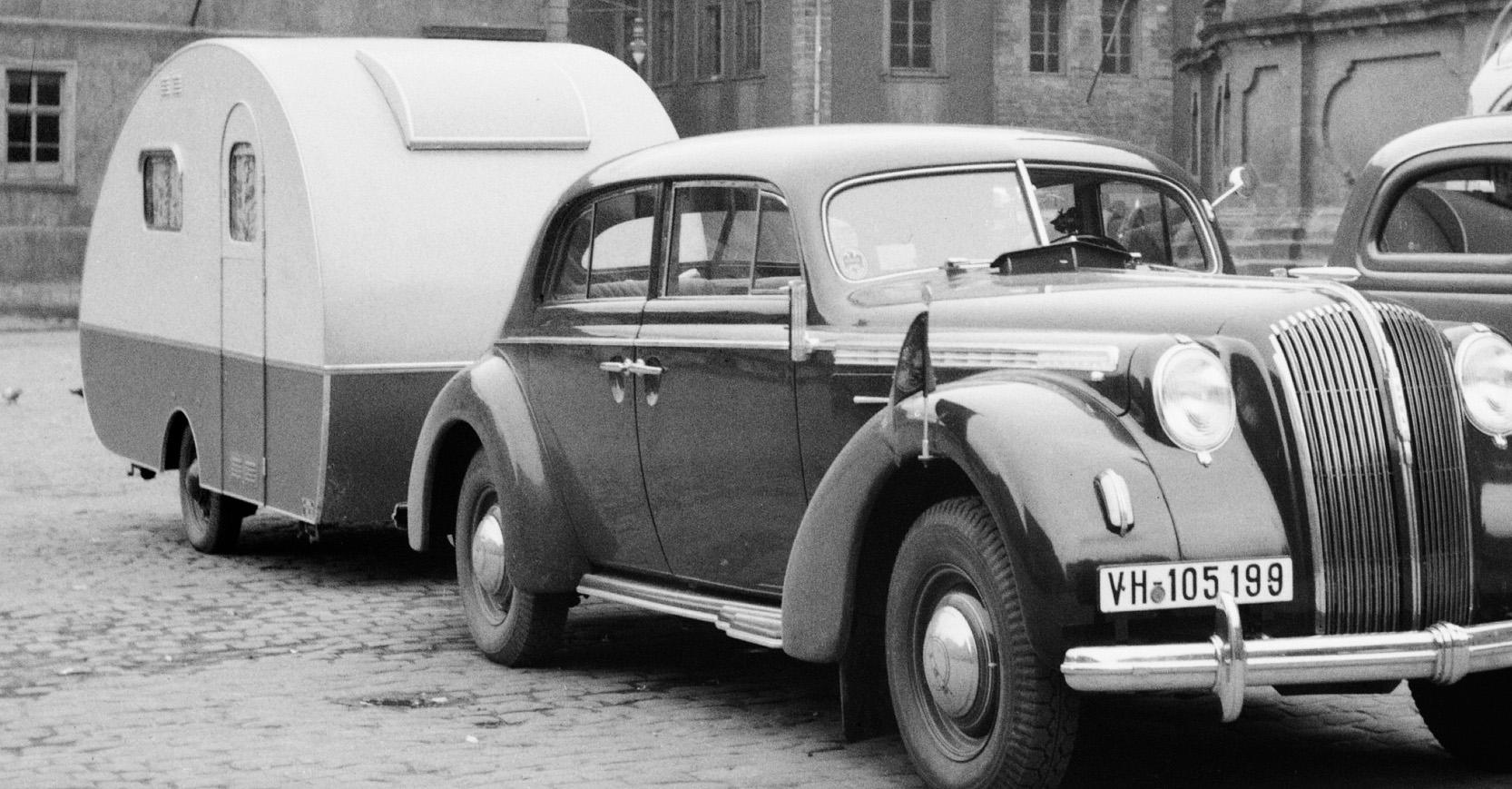 Car, trailer at Heiligeistkriche church Heidelberg, Germany 1938, Printed Later  - Photograph by Karl Heinrich Lämmel