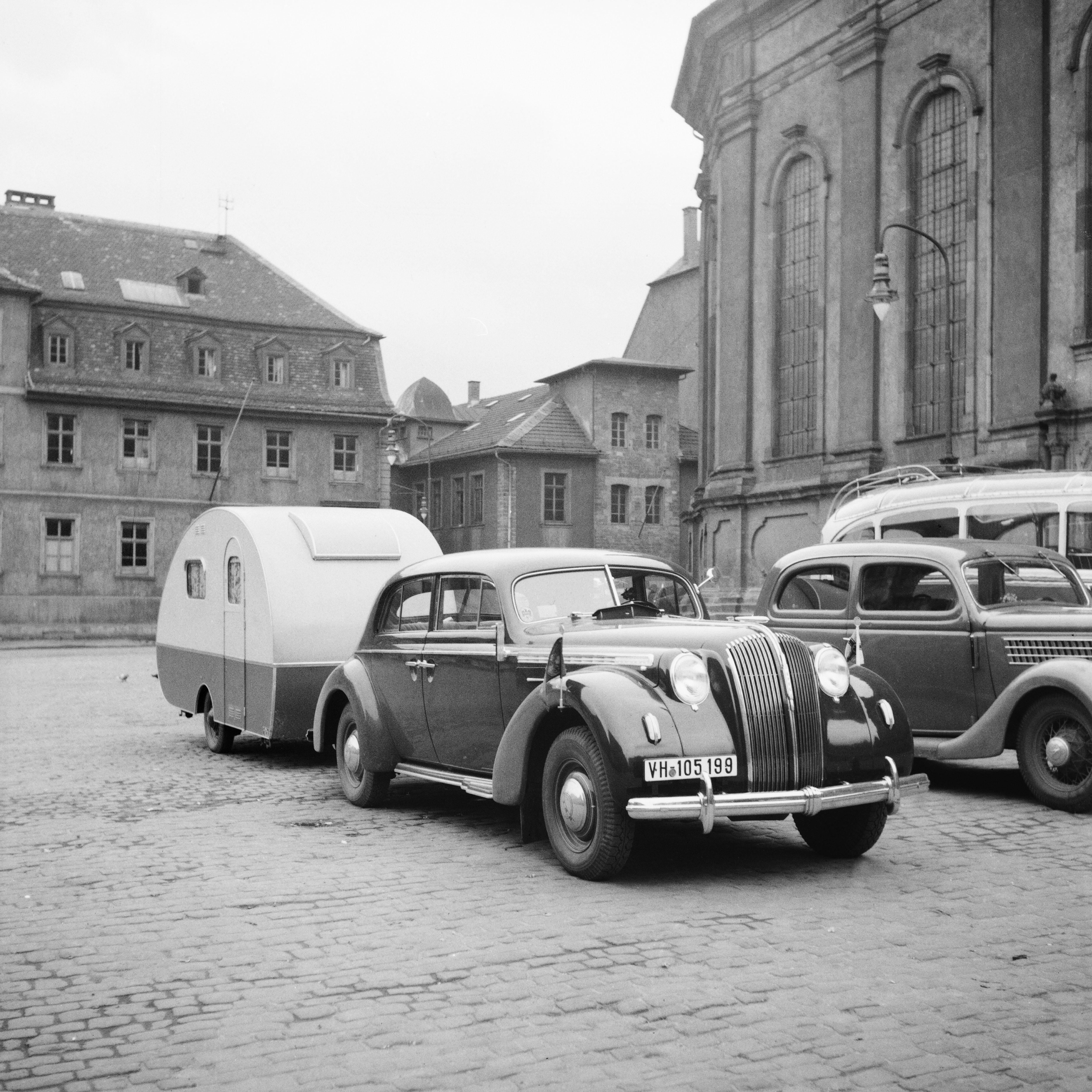 Karl Heinrich Lämmel Black and White Photograph - Car, trailer at Heiligeistkriche church Heidelberg, Germany 1938, Printed Later 