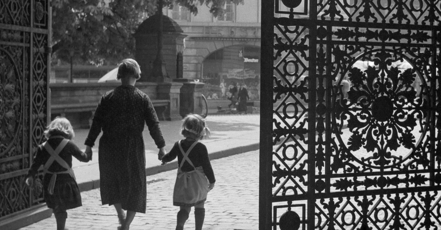 Entrance gate Darmstadt castle girls and woman, Germany 1938 Printed Later  - Photograph by Karl Heinrich Lämmel