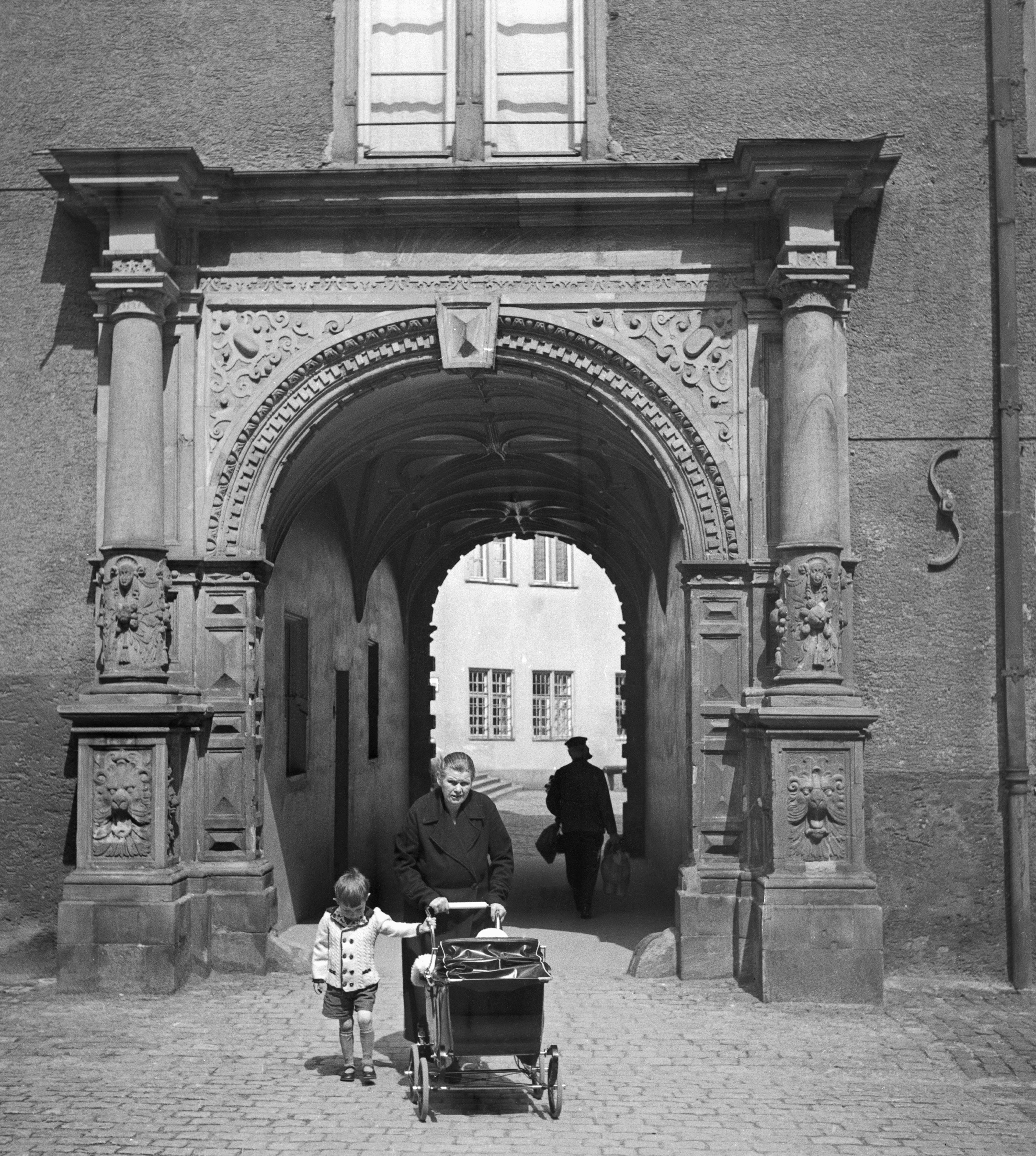 Karl Heinrich Lämmel Black and White Photograph - Gate Darmstadt castle granny grandchild stroller, Germany 1938 Printed Later 
