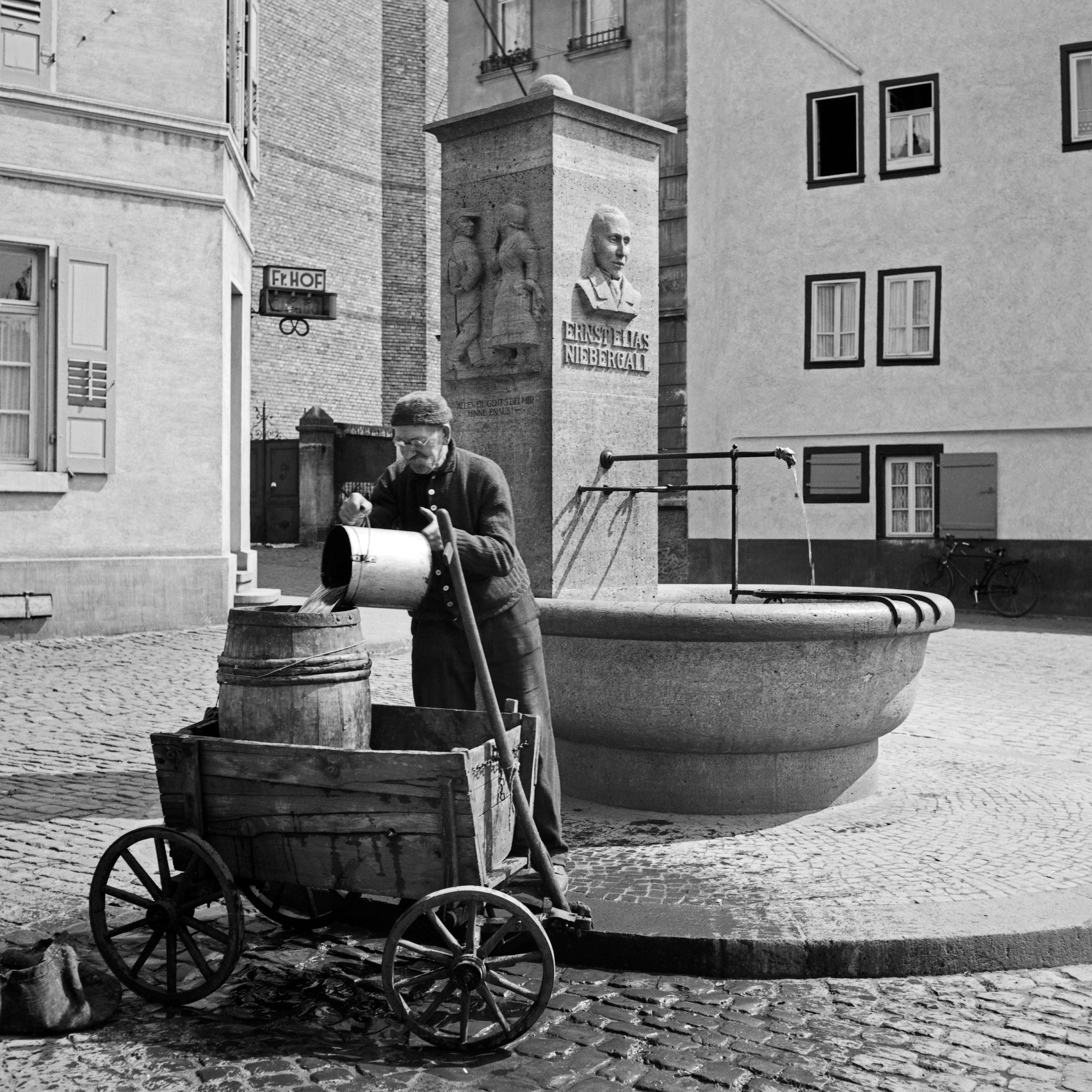 Karl Heinrich Lämmel Black and White Photograph - Man at Ernst Elias Niebergall fountain Darmstadt, Germany 1938 Printed Later 