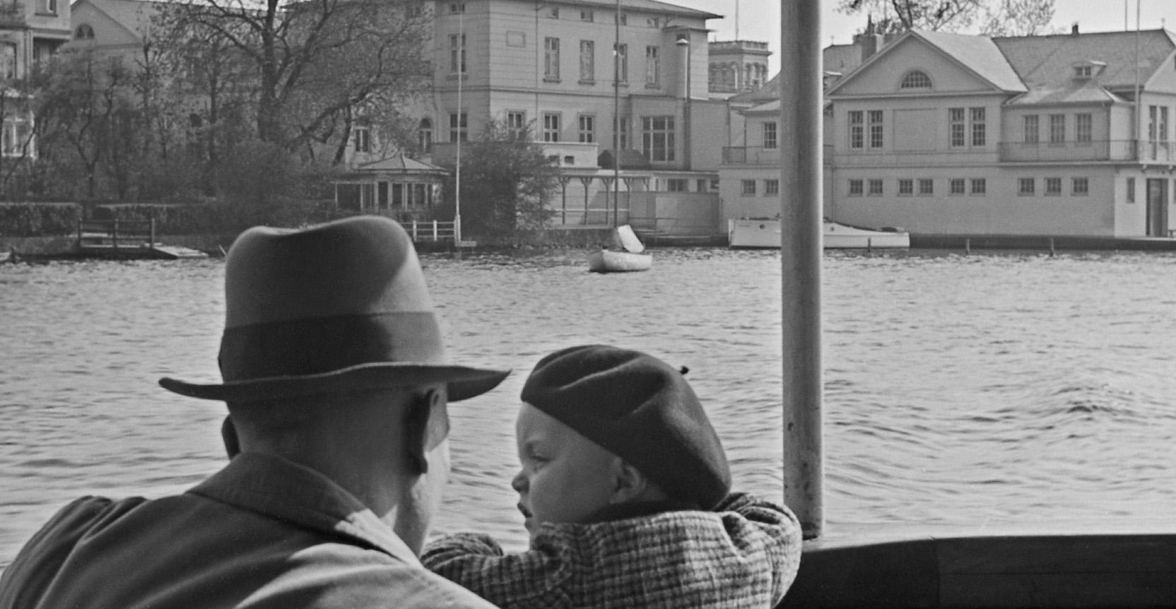 Man, child passing ferry house Hamburg Uhlenhorst , Germany 1938, Printed Later  - Photograph by Karl Heinrich Lämmel